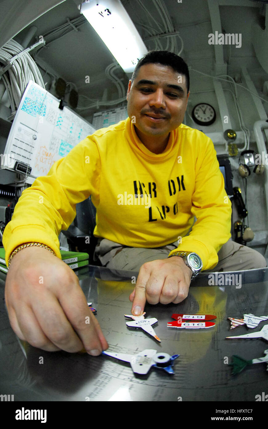 Sanders, chief aviation boatswains mate (handling), adjusts