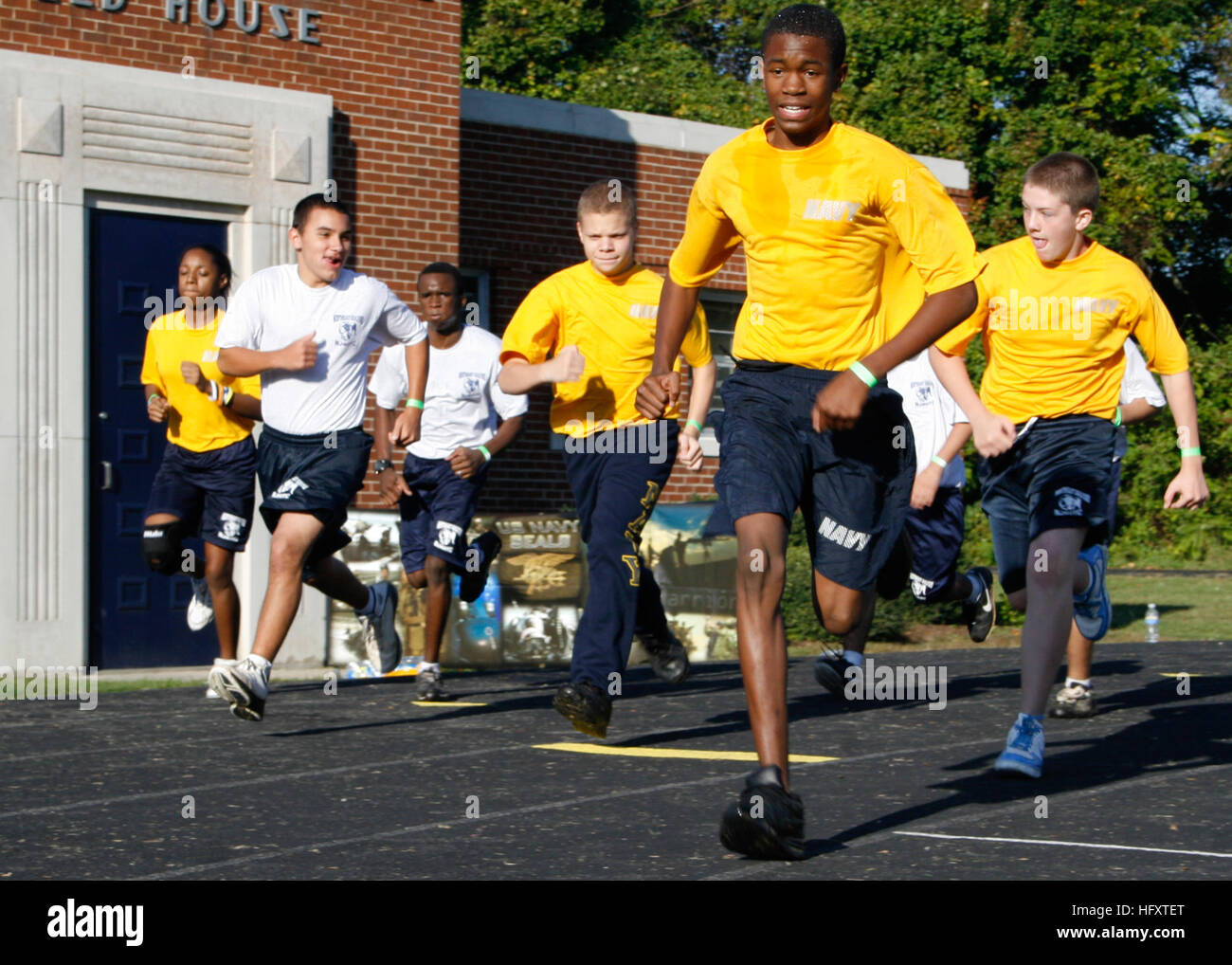 091003-N-5366K-068  GREENSBORO, N.C. (Oct. 3, 2009) Navy Junior ROTC members begin a 1.5-mile run during a Navy SEAL Fitness Challenge held at Grimsley High School.  Naval Special Warfare (NSW) operators hosted the event, which included a 500-yard swim followed by push-ups, sit-ups, pull-ups and the run, in an effort to promote fitness among Americans and to raise awareness about NSW programs. (U.S. Navy photo by Mass Communication Specialist 2nd Class Michelle Kapica/Released) US Navy 091003-N-5366K-068 Navy Junior ROTC members begin a 1.5-mile run during a Navy SEAL Fitness Challenge held at Stock Photo