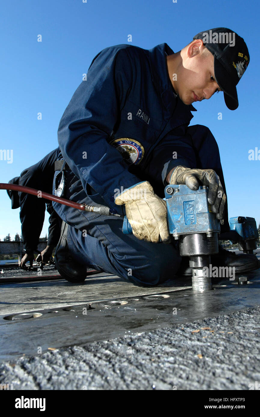 Retainer Aviation Aviation Boatswain's Mate (Equipment) tightens a retainer rail bolt on ...