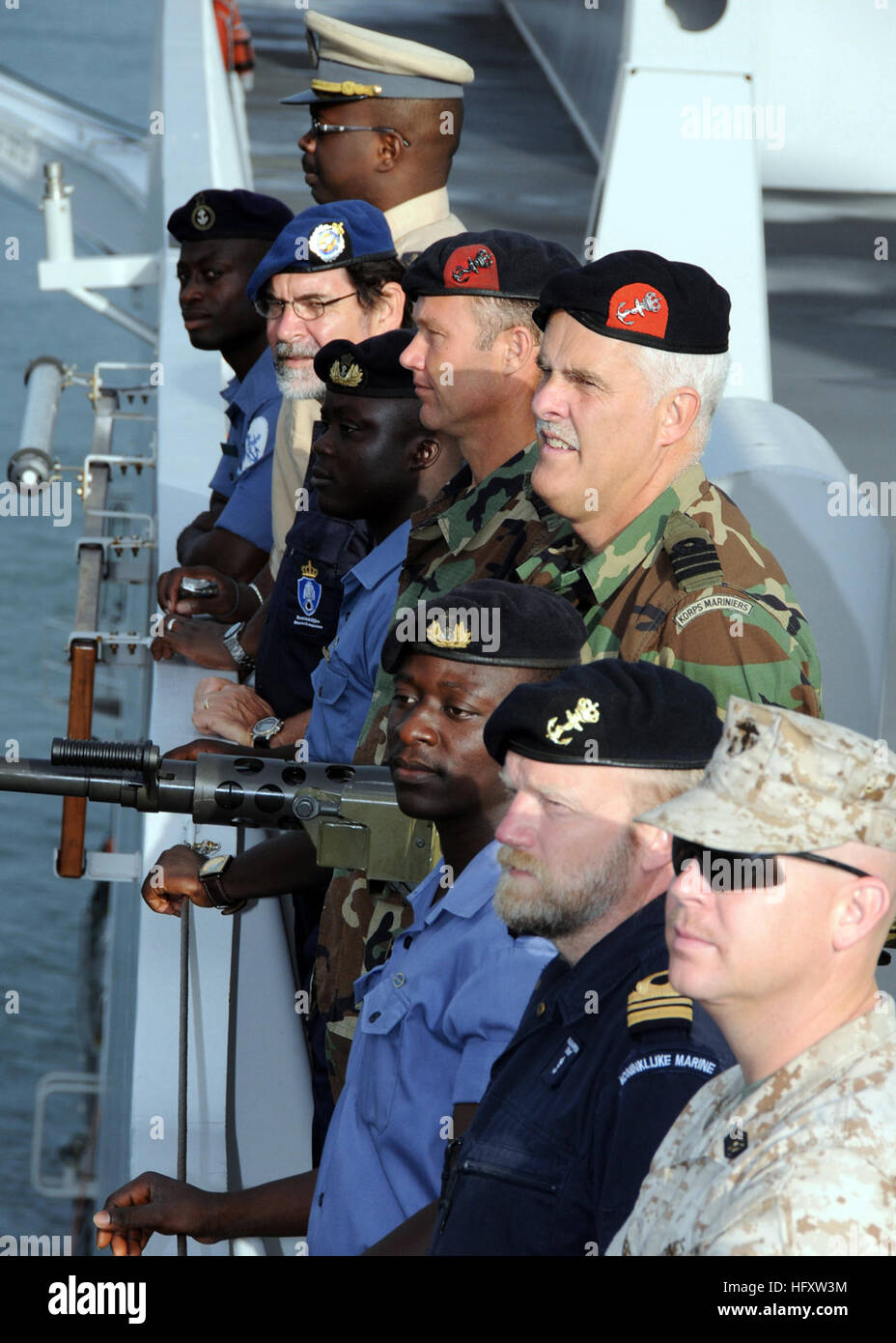 091014-O-1429M-013 FREETOWN, Sierra Leone (Oct. 14, 2009) Sailors and Marines from Ghana, Senegal, the Netherlands and the U.S. man the rails aboard the Royal Dutch navy amphibious ship HNLMS Johan De Witt (L 801) as the ship enters port.  Johan De Witt is in Sierra Leone for a two-day port visit where she will deliver medical and relief supplies supporting Africa Partnership Station.  Johan De Witt is the first European-led Africa Partnership Station platform and is augmented by personnel from Belgium, Portugal and the United States.  Africa Partnership Station was originally a U.S. Navy init Stock Photo