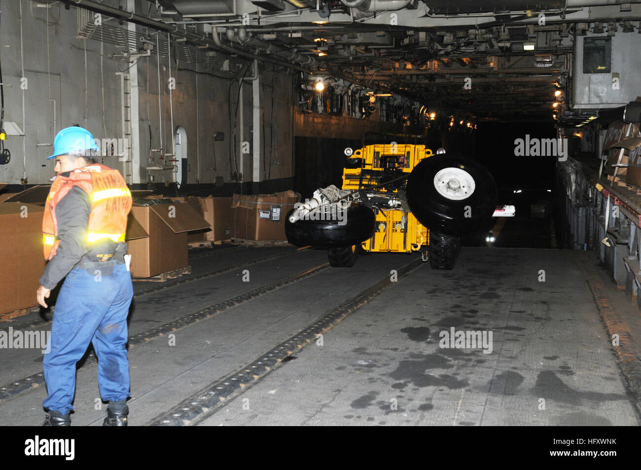 Sailors aboard USS Peleliu (LHA 5) recover landing gear from a Coast ...