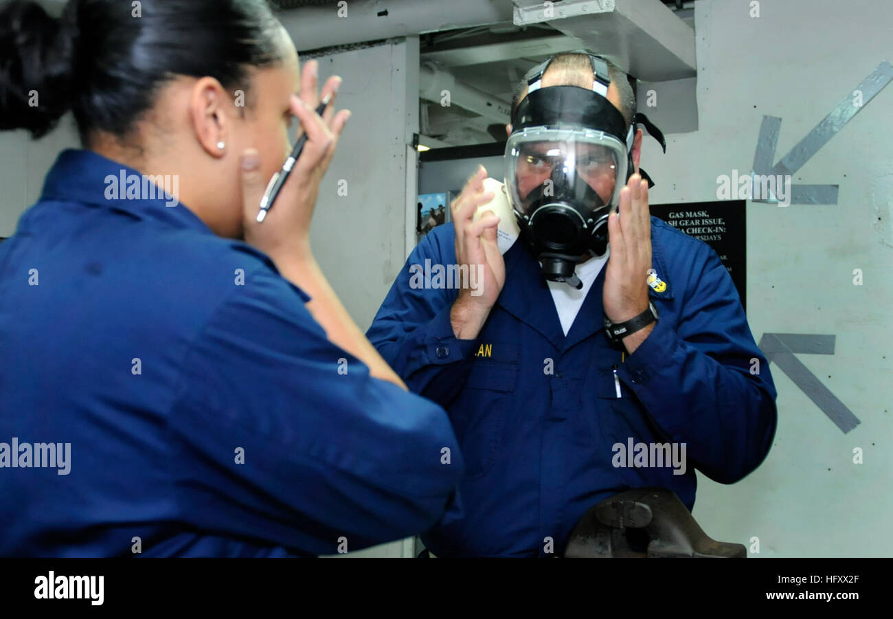 Damage control personnel aboard USS Blue Ridge demonstrate proper gas ...
