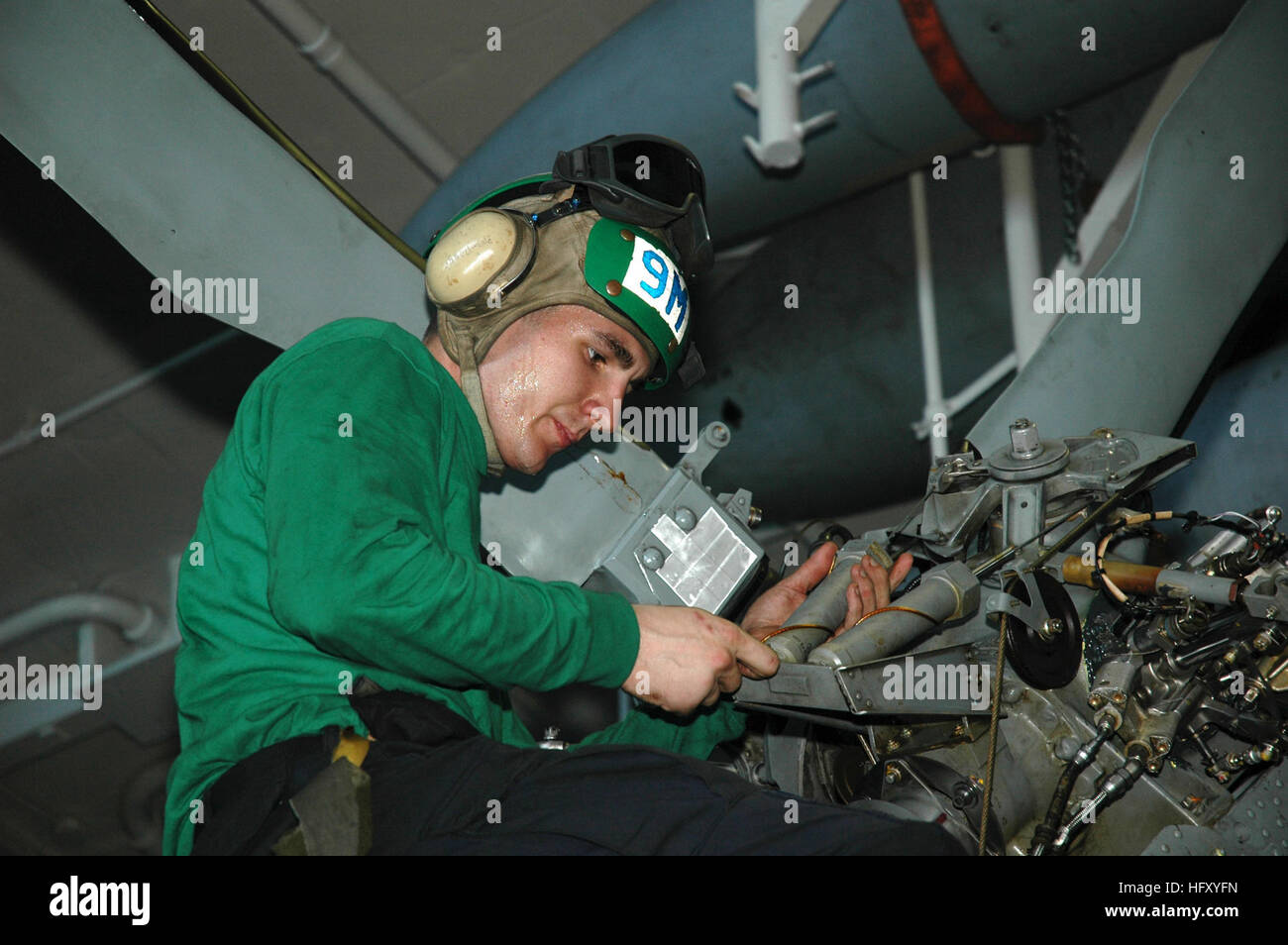 091215-N-3327M-064 NORTH ARABIAN SEA (Dec. 15, 2009) Aviation Structural Mechanic 3rd Class John Kerr, assigned to the Indians of Helicopter Anti-Submarine Squadron (HS) 6, conducts maintenance on the tail rig of an HH-60S Sea Hawk helicopter aboard the aircraft carrier USS Nimitz (CVN 68). Nimitz and the Nimitz Carrier Strike Group are on a scheduled deployment to the U.S. 5th Fleet area of responsibility. (U.S. Navy photo by Mass Communication Specialist 3rd Class James Mitchell/Released) US Navy 091215-N-3327M-064 Aviation Structural Mechanic 3rd Class John Kerr, assigned to the Indians of  Stock Photo