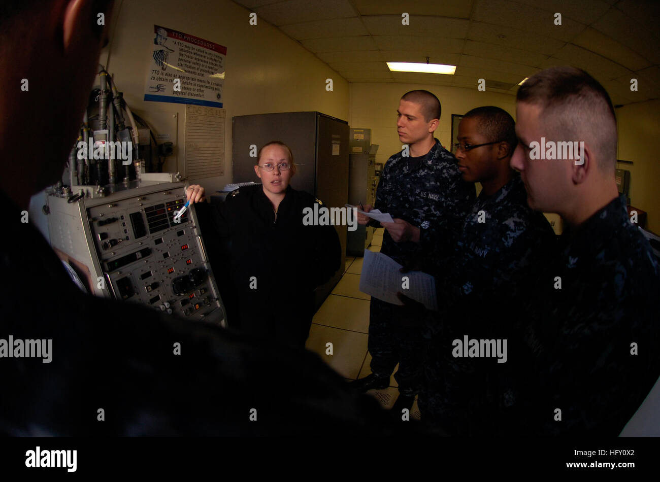 A Fire Controlman 1st Class provides instruction on the Phalanx Close ...