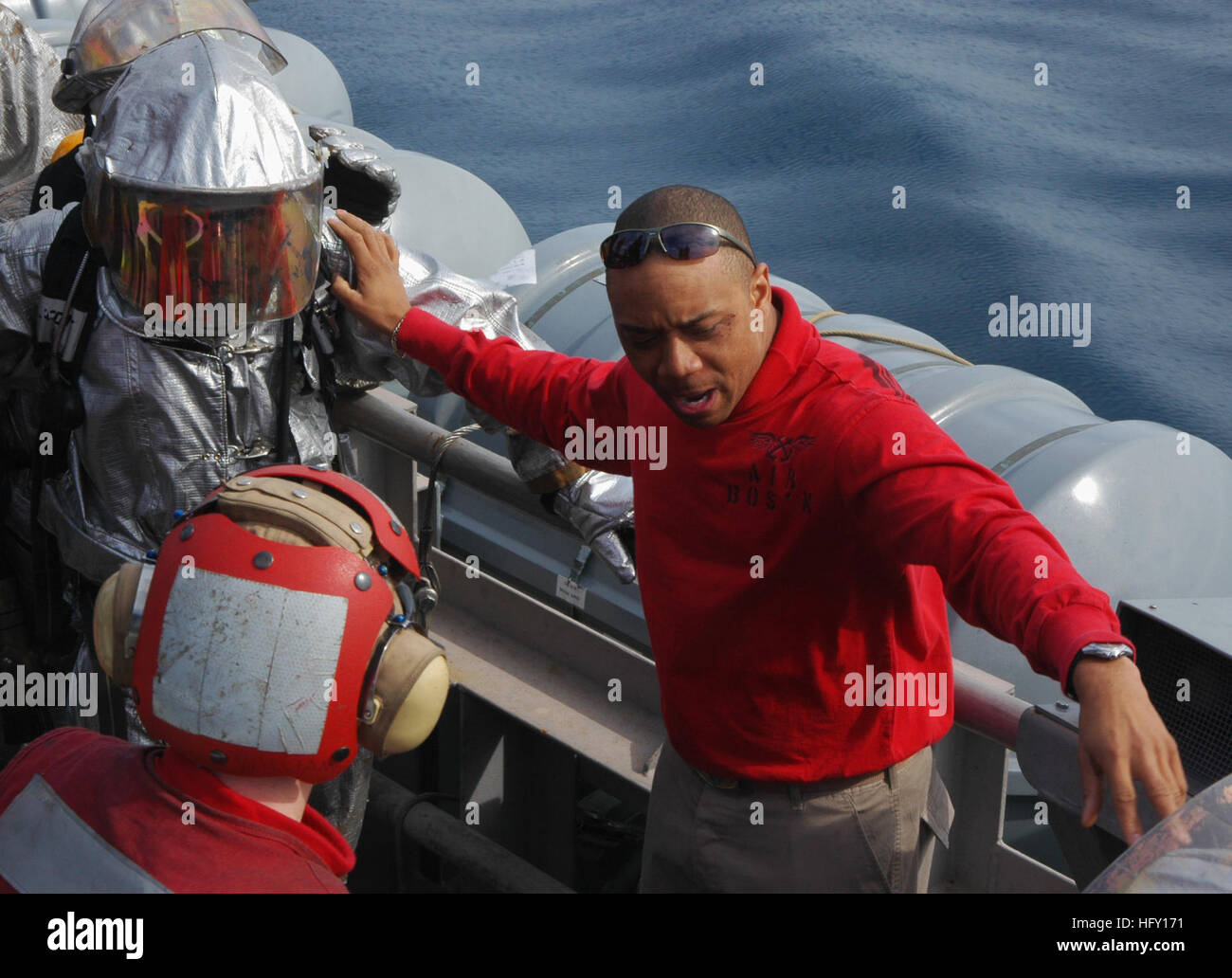 Sailors from the crash and salvage division train during a simulated ...