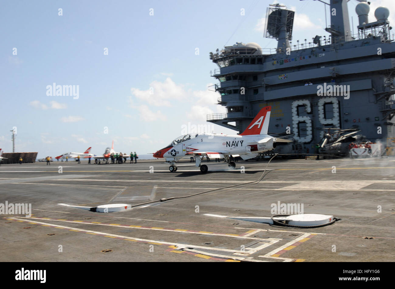 110728-N-SR846-046 ATLANTIC OCEAN (July 28, 2011) A T-45C Goshawk training aircraft assigned to Chief of Naval Air Training (CNATRA) lands aboard the aircraft carrier USS Dwight D. Eisenhower (CVN 69). Dwight D. Eisenhower is underway assisting CNATRA in preparing naval aviators for future carrier-based operations. (U.S. Navy photo by Mass Communication Specialist Seaman Rob Rupp/Released) US Navy 110728-N-SR846-046 A T-45C Goshawk training aircraft lands aboard USS Dwight D. Eisenhower (CVN 69) Stock Photo