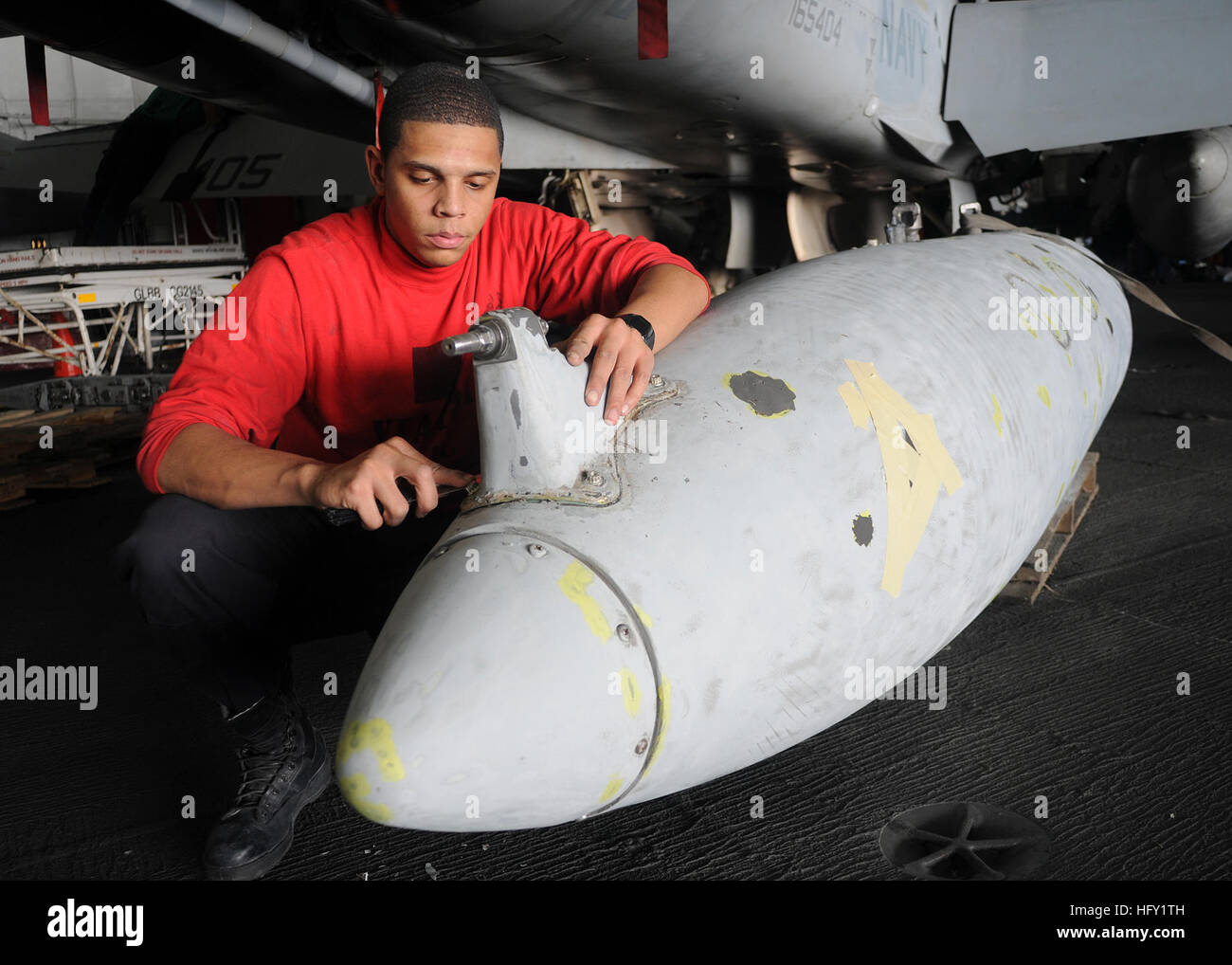 100206-N-4236E-112  GULF OF OMAN (Feb. 6, 2010) Aviation Ordnanceman Airman Apprentice Madison Hendrick, assigned to the Wildcats of Strike Fighter Squadron (VFA) 131, performs corrosion repair on a drop tank aboard the Nimitz-class aircraft carrier USS Dwight D. Eisenhower (CVN 69). Dwight D. Eisenhower is deployed as part of an on-going rotation of forward-deployed forces to support maritime security operations in the 5th Fleet area of responsibility. (U.S. Navy photo by Mass Communication Specialist 3rd Class Chad R. Erdmann/Released) US Navy 100206-N-4236E-112 Aviation Ordnanceman Airman A Stock Photo