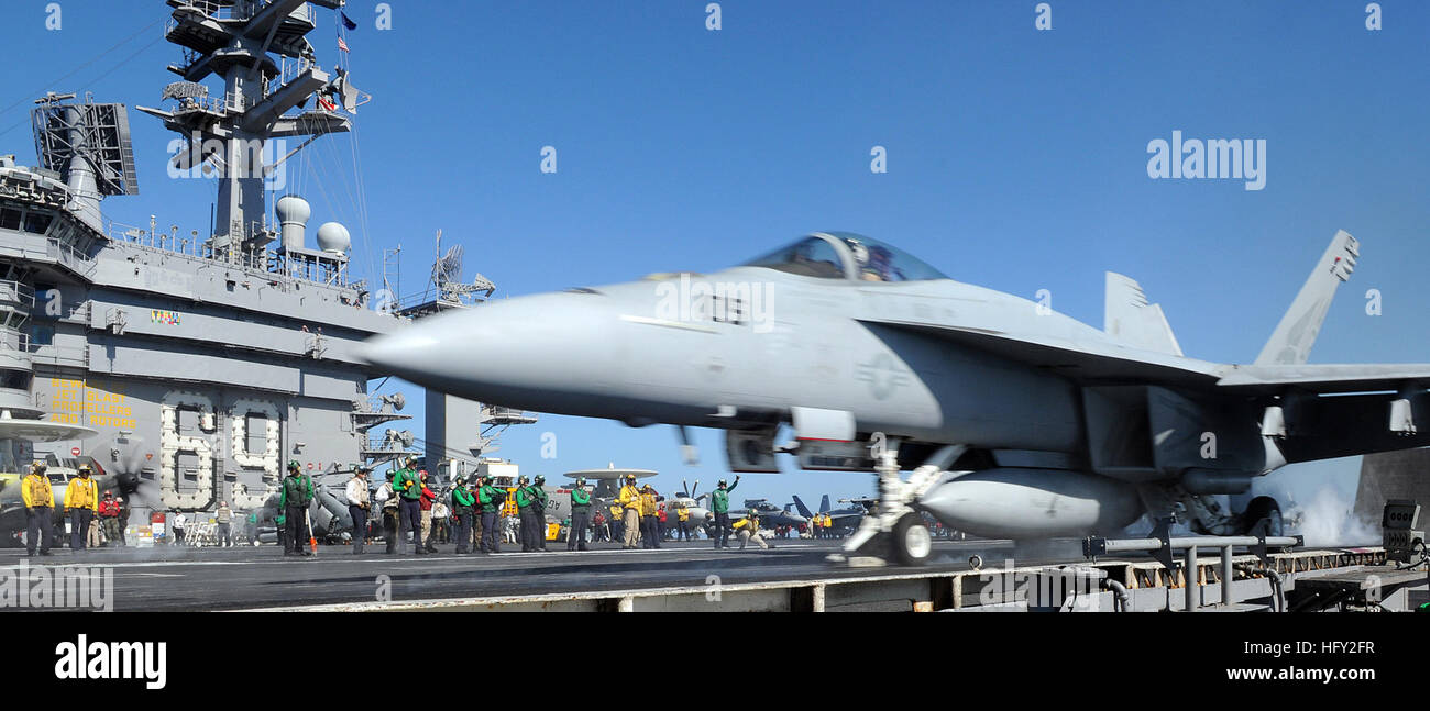 100220-N-4236E-247 GULF OF OMAN (Feb. 20, 2010) An F/A-18E Super Hornet from the Pukin Dogs of Strike Fighter Squadron (VFA) 143 prepares to launch from the flight deck of the Nimitz-class aircraft carrier USS Dwight D. Eisenhower (CVN 69). Dwight D. Eisenhower is on a scheduled six-month deployment as part of the on-going rotation of forward-deployed forces. (U.S. Navy photo by Mass Communication Specialist 3rd Class Chad R. Erdmann/Released) US Navy 100220-N-4236E-247 An F-A-18E Super Hornet from the Pukin Dogs of Strike Fighter Squadron (VFA) 143 prepares to launch from the flight deck of t Stock Photo