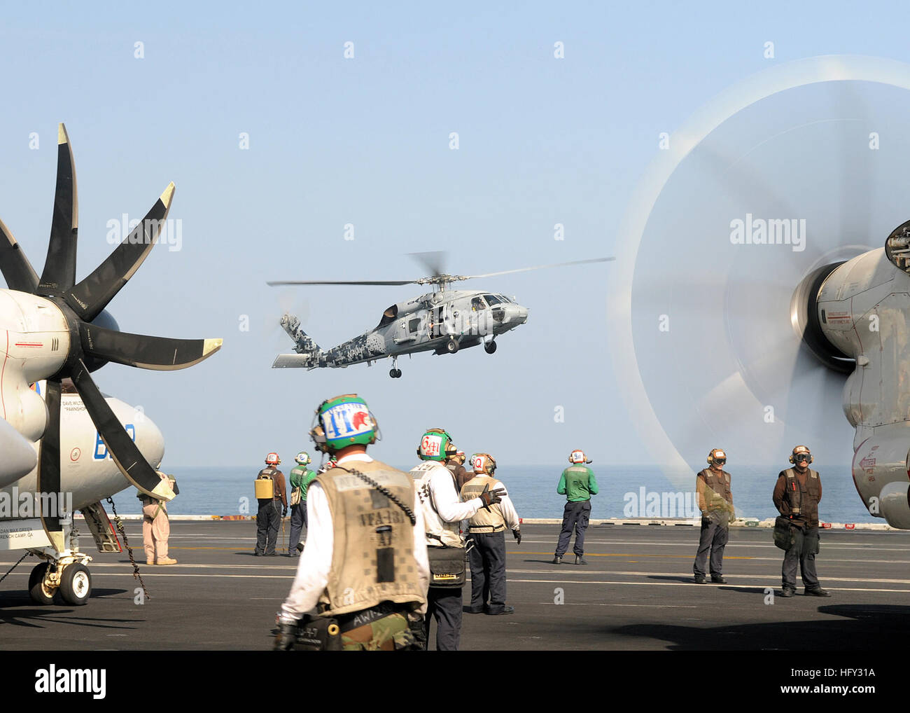 100228-N-4236E-004 GULF OF OMAN (Feb. 28, 2010) Sailors conduct flight operations aboard the Nimitz-class aircraft carrier USS Dwight D. Eisenhower (CVN 69). Dwight D. Eisenhower is on a six-month deployment as a part of the on-going rotation of forward-deployed forces. (U.S. Navy photo by Mass Communication Specialist 3rd Class Chad R. Erdmann/Released) US Navy 100228-N-4236E-004 Sailors conduct flight operations aboard the Nimitz-class aircraft carrier USS Dwight D. Eisenhower (CVN 69) Stock Photo