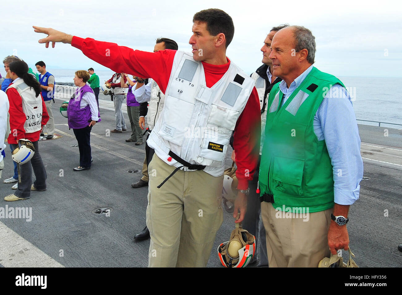 100302-N-2953W-593 CARL VINSON - USS Carl Vinson’s (CVN 70), Executive Officer Cmdr. Putnam H. Browne, explains flight operations to a Brazilian visitor before a flight demonstration on the flight deck of the nuclear-powered aircraft carrier.  The ship is underway in support of Southern Seas 2010, a major component of Commander, U.S. Naval Forces Southern Command (COMUSNAVSO) Partnership of the Americas maritime engagement strategy and theater security cooperation activities to enhance regional stability and strengthen relationships among regional partners. (U.S. Navy photo by Mass Communicati Stock Photo