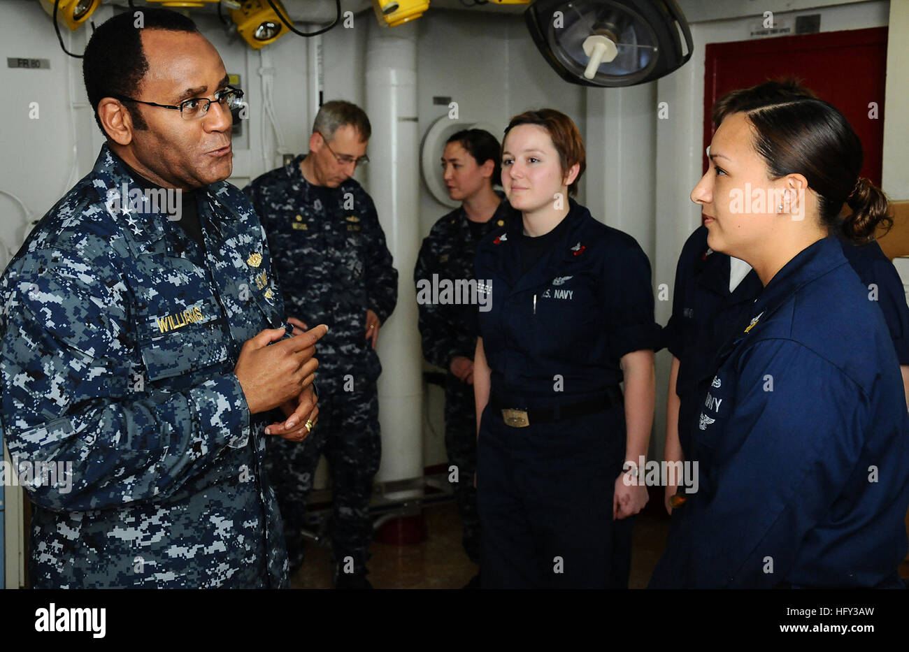 Vice Adm. Mel Williams Jr., commander of U.S. 2nd Fleet, speaks with Petty Officer 1st Class Ingrid Cortez, hospital corpsman, leading petty officer of the medical department aboard the amphibious assault ship USS Bataan. Williams toured the ship and thanked the crew for their work during Operation Unified Response. (U.S. Navy photo by Petty Officer 2nd Class Julio Rivera) USS Bataan DVIDS258130 Stock Photo