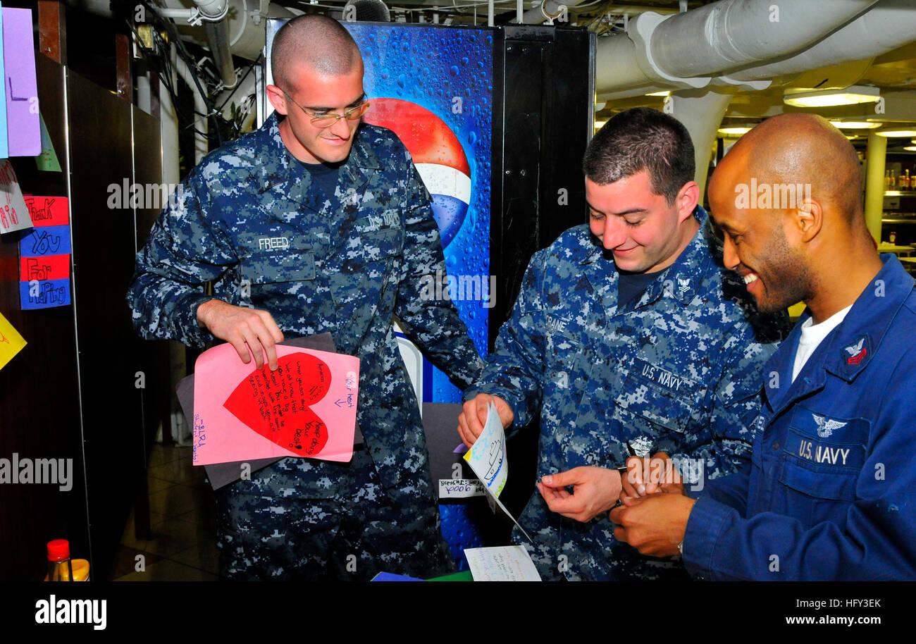 Airman Alex Freed, aviation electronics technician, posts 'Thank You' cards on the mess decks of the aircraft carrier USS Carl Vinson. Carl Vinson a taking part in Southern Seas 2010, a U.S. Southern Command-directed operation that provides U.S. and international forces the opportunity to operate in a multi-national environment. (U.S. Navy photo by Seaman Apprentice Joshua Boyer) USS Carl Vinson DVIDS258139 Stock Photo