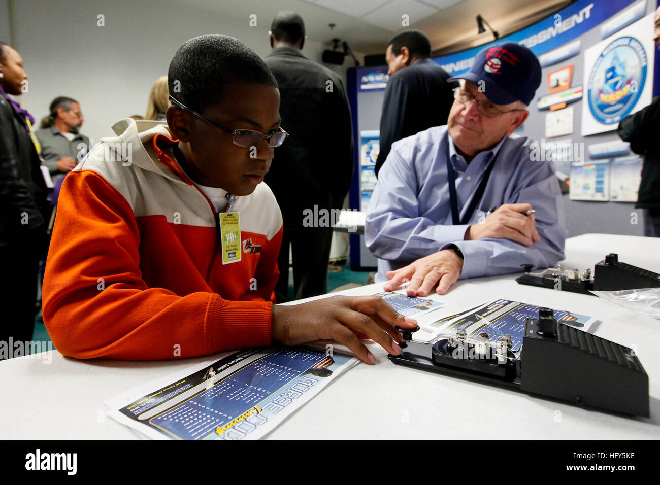 Workers Using Morse Code An engineer teaches Morse Code to students during a Take A Child 2 Work ...