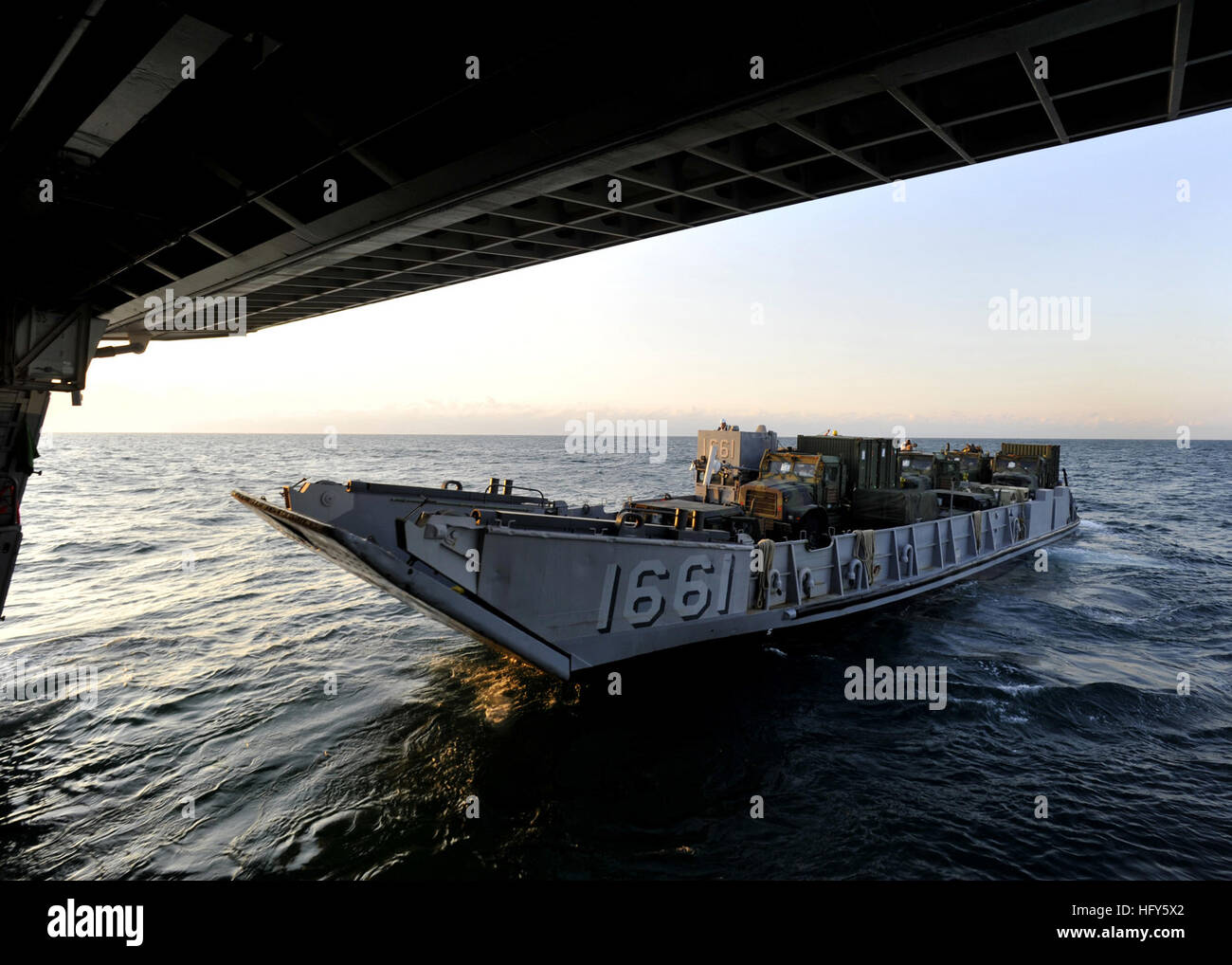 100428-N-2147L-001 ONSLOW BAY, N.C.  (April 28, 2010) Landing Craft Utility (LCU) 1661, assigned to  Assault Craft  Unit  (ACU) 2, departs the well deck of the amphibious transport dock ship USS New York (LPD 21). New York is underway conducting training in the Atlantic Ocean. (U.S. Navy photo by Mass Communication Specialist 1st Class Corey Lewis/Released) US Navy 100428-N-2147L-001 Landing Craft Utility (LCU) 1661, assigned to Assault Craft Unit (ACU) 2, Stock Photo