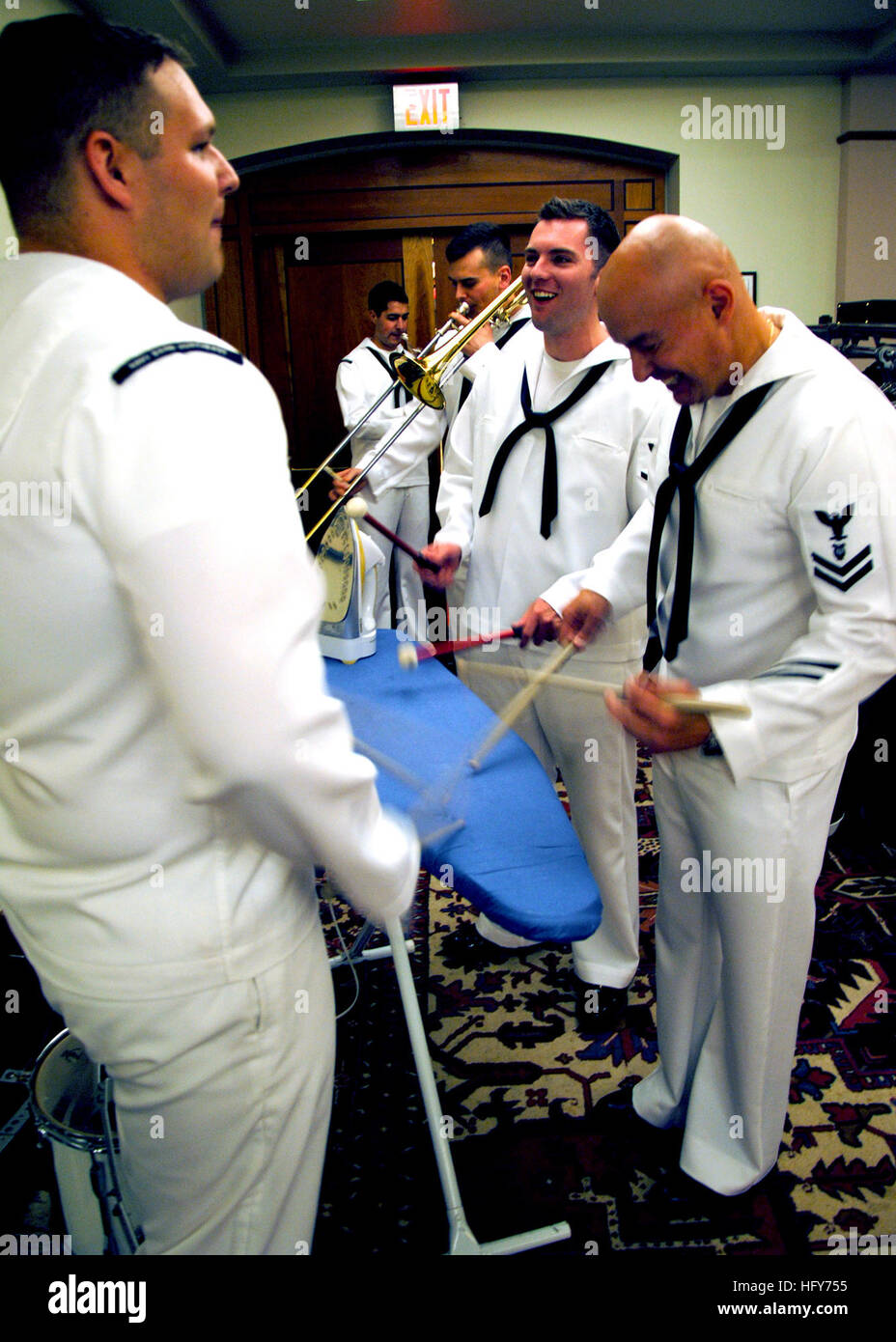 100521-N-7642M-075 BOSTON (May 21, 2010) Musician 3rd Class Stefan Griffin, left, Musician 2nd Class Steven DiResto and Musician 3rd Class Tim Leonard, all assigned to the U.S. Navy Band Northeast warm up on an ironing board before their performance at Boston Symphony Hall. The Navy Band played the finale at the 125th anniversary of the Boston Pops. (U.S. Navy photo by Mass Communication Specialist Seaman Kathryn E. Macdonald/Released) US Navy 100521-N-7642M-075 Musician 3rd Class Stefan Griffin, Musician 2nd Class Steven DiResto and Musician 3rd Class Tim Leonard warm up on an ironing board b Stock Photo