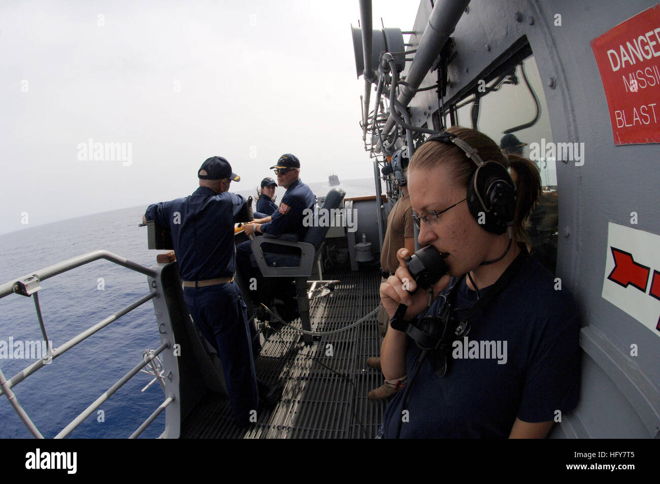 100603-N-0553R-059 GULF OF ADEN (June 3, 2010) Yeoman Seaman Britanny Engbrecht, embarked aboard the guided-missile cruiser USS San Jacinto (CG 56), conducts a communications check as the ship prepares to come alongside the Military Sealift Command dry cargo and ammunition ship USNS Robert E. Peary (T-AKE 5) to conduct a replenishment at sea. San Jacinto is part of Combined Task Force 151, a multinational task force established in January 2009 to conduct counter-piracy operations. Combined Task Force 151 operates in the Gulf of Aden and the east coast of Somalia. (U.S. Navy photo by Mass Commu Stock Photo