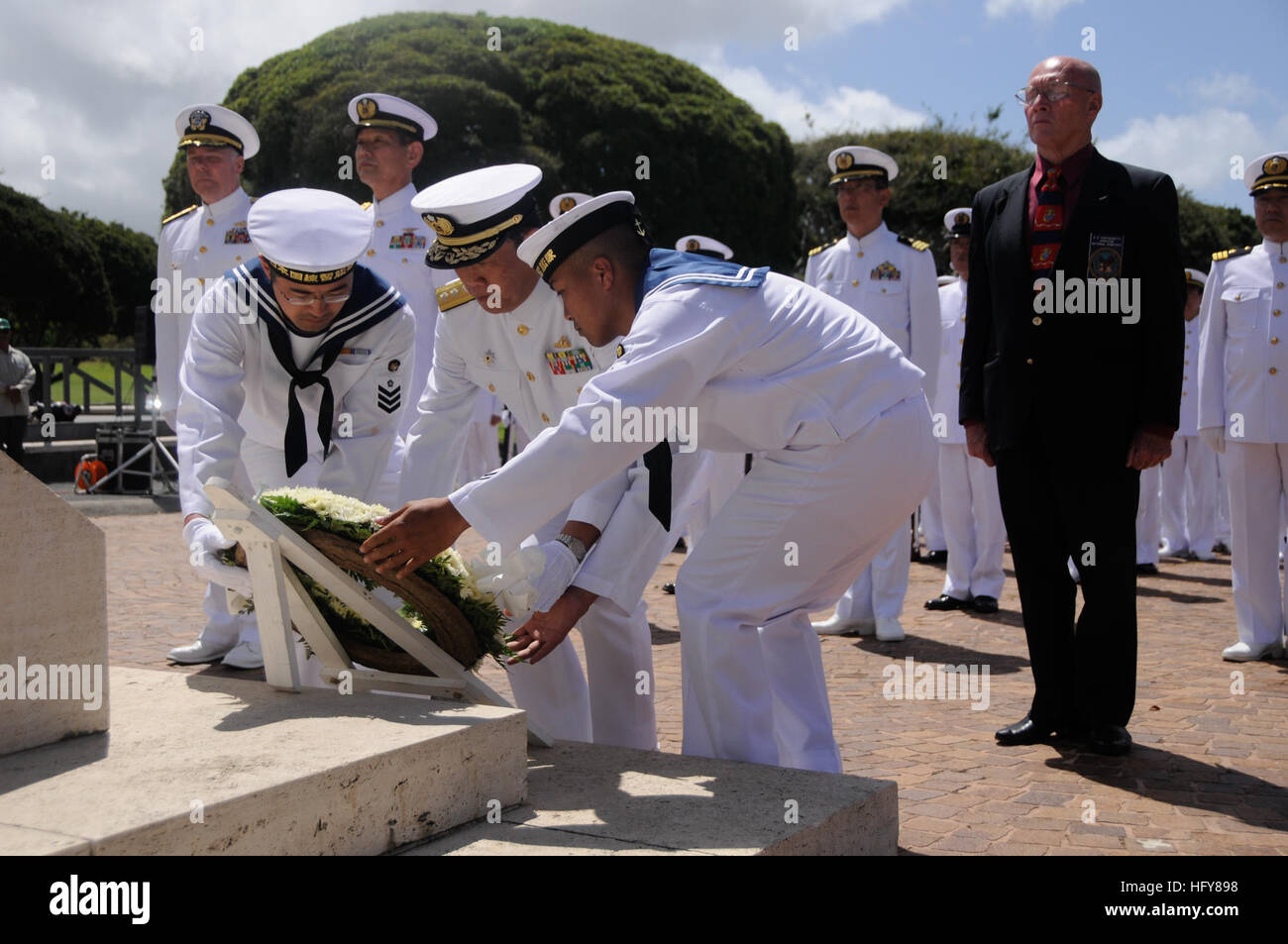 100609-N-7498L-193 HONOLULU (June 9, 2010) Japan Maritime Self-Defense Force Rear Adm. Tomohisa Takei lays a wreath at the National Memorial Cemetery of the Pacific at the Puowaina Crater. The Japan Maritime Self-Defense Force Training Squadron arrived at Joint Base Pearl Harbor-Hickam to participate in various professional exchanges and social events with U.S. counterparts. This year marks the 50th anniversary of the U.S. and Japan Treaty of Mutual Cooperation of Security that in 1960 established the alliance between the two countries. (U.S. Navy photo by Mass Communication Specialist 2nd Cla Stock Photo