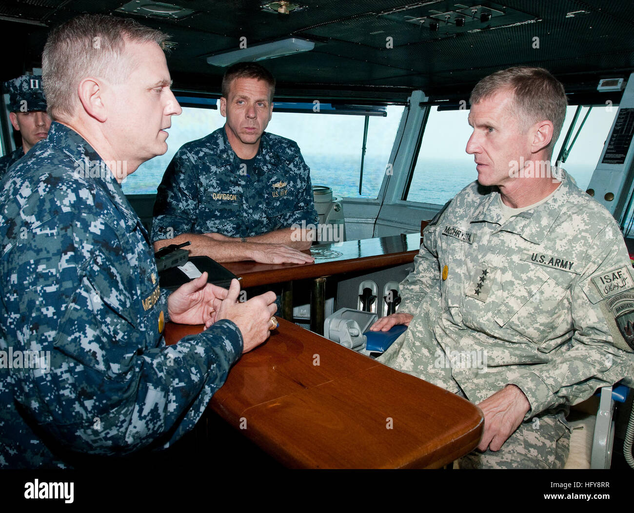 100617-N-1928O-310 ARABIAN GULF (June 17, 2010) Capt. Dee Mewbourne, left, commanding officer of the aircraft carrier USS Dwight D. Eisenhower (CVN 69), speaks with Rear Adm. Phil Davidson, commander of Carrier Strike Group 8 and Gen. Stanley McChrystal, commander of the NATO International Security Assistance Force and U.S. Forces Afghanistan, on the bridge of Dwight D. Eisenhower. McChrystal is on a battlefield circulation visit to the ship. The Eisenhower Carrier Strike Group is supporting Operation Enduring Freedom. (U.S. Navy photo by Mass Communication Specialist 1st Class Mark OÕDonald/R Stock Photo
