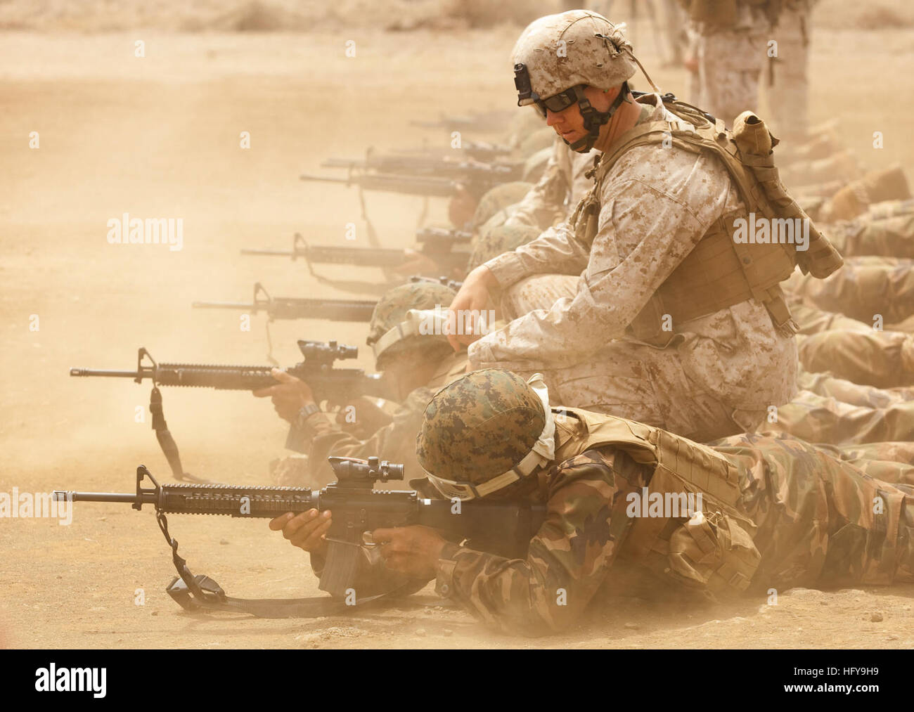 100630-M-2339L-102 MARINE CORPS BASE, Hawaii (June 30, 2010) Cpl. Dave Spraker, a team leader with 3rd platoon, Company E, 2nd Battalion, 3rd Marine Regiment, instructs Royal Tongan marines during a battle sight zero exercise at the Range Training Facility at Marine Corps Base Hawaii for Rim of the Pacific (RIMPAC) 2010. RIMPAC is a biennial, multinational exercise designed to strengthen regional partnerships and improve interoperability. (U.S. Marine Corps photo by Lance Cpl. Reece E. Lodder/Released) US Navy 100630-M-2339L-102 Cpl. Dave Spraker instructs Royal Tongan marines during a battle  Stock Photo