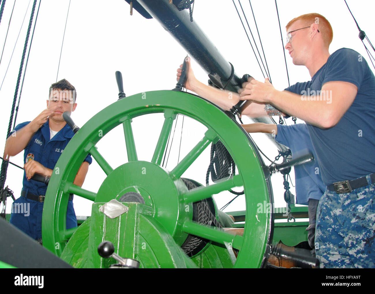 Esteban Quintero, fireman apprentice, left, and Airman Dylan Roberts, both assigned to USS Constitution, steer the rudder aboard the Friendship of Salem as part of their final evolution of sail training. Constitution Sailors hope to use this training for the possibility of sailing Constitution under her own power for the bicentennial of the War of 1812. (U.S. Navy photo by Seaman Apprentice Shannon Heavin) USS Constitution DVIDS300923 Stock Photo