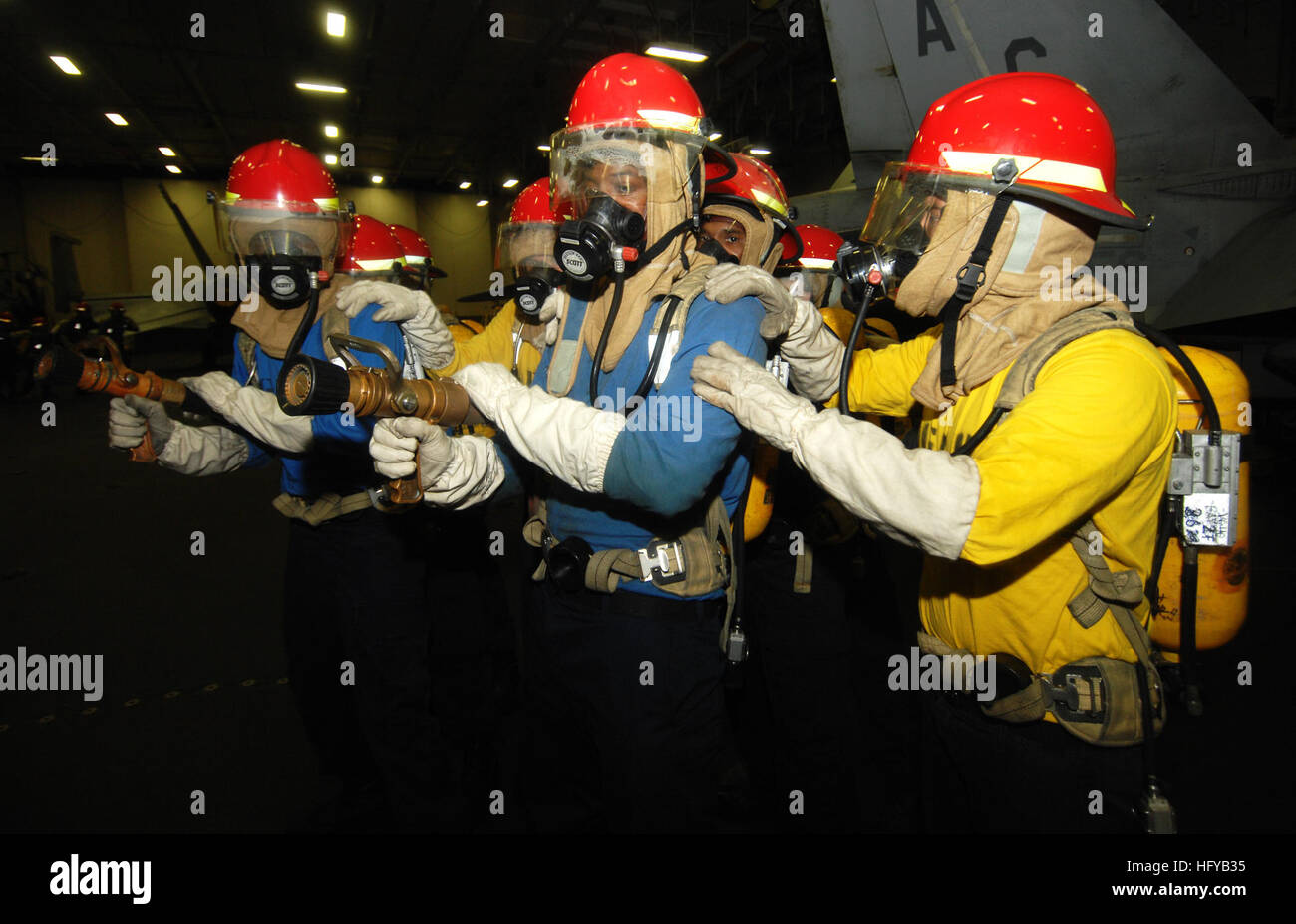 100727-N-6582H-049 U.S. 5TH FLEET AREA OF RESPONSIBILITY (July 27, 2010) Sailors man fire hoses during a simulated fire aboard the aircraft carrier USS Harry S. Truman (CVN 75). The Harry S. Truman Carrier Strike Group is deployed supporting maritime security operations and theater security cooperation efforts in the U.S. 5th Fleet area of responsibility. (U.S. Navy photo by Mass Communication Specialist 3rd Class Jared Hall/Released) US Navy 100727-N-6582H-049 Sailors man fire hoses during a simulated fire aboard the aircraft carrier USS Harry S. Truman (CVN 75) Stock Photo