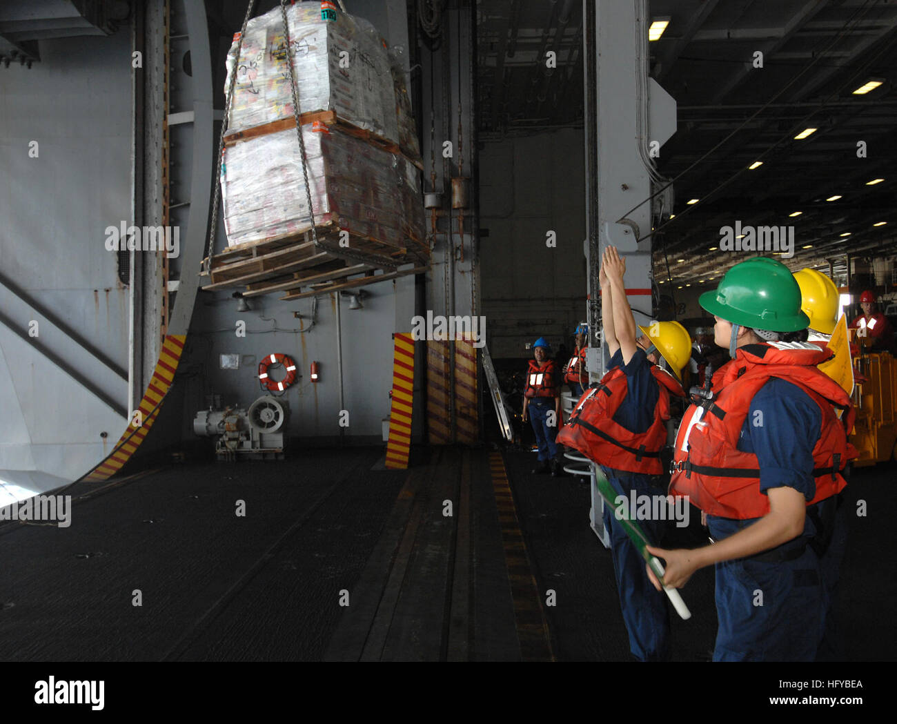 100804-N-6582H-111 ARABIAN SEA (Aug. 4, 2010) Sailors aboard the aircraft carrier USS Harry S. Truman (CVN 75) receive supplies during a replenishment at sea. The Harry S. Truman Carrier Strike Group is supporting maritime security operations and theater security cooperation efforts in the U.S. 5th Fleet area of responsibility. (U.S. Navy photo by Mass Communication Specialist 3rd Class Jared Hall/Released) US Navy 100804-N-6582H-111 Sailors aboard the aircraft carrier USS Harry S. Truman (CVN 75) receive supplies during a replenishment at sea Stock Photo