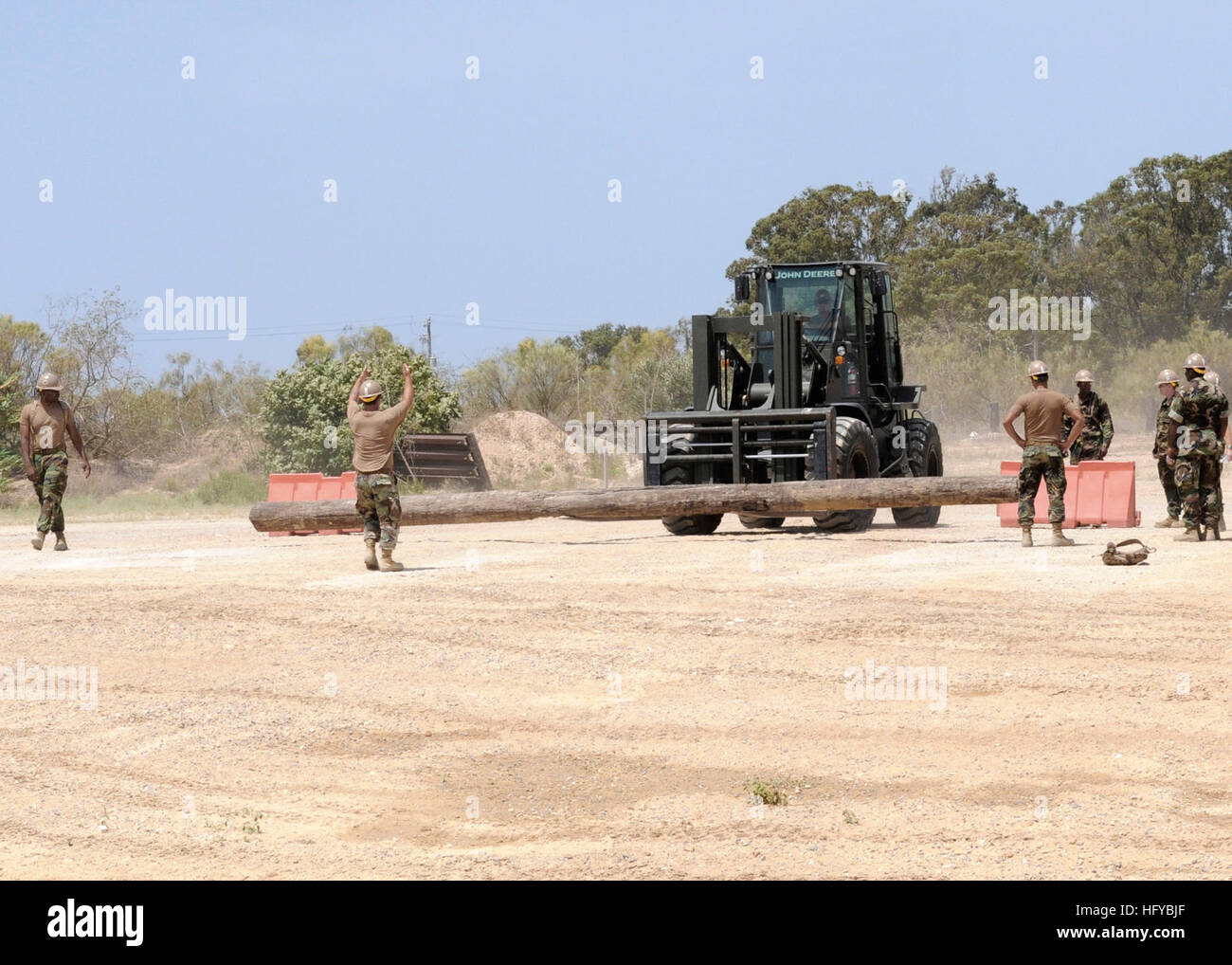 100807-N-6357K-011 ROTA, Spain (Aug. 7, 2010) Seabees assigned to Naval Mobile Construction Battalion (NMCB) 7 conduct John Deer 12K forklift handling proficiency training during a training exercise at Camp Mitchell at Naval Base Rota, Spain. NMCB-7 and its detachments are deployed to the U.S. 6th Fleet area of responsibility to provide construction and engineering support. (U.S. Navy photo by Chief Mass Communication Specialist Yan Kennon/Released) US Navy 100807-N-6357K-011 Seabees conduct John Deer 12K forklift handling proficiency training during a training exercise at Camp Mitchell at Nav Stock Photo