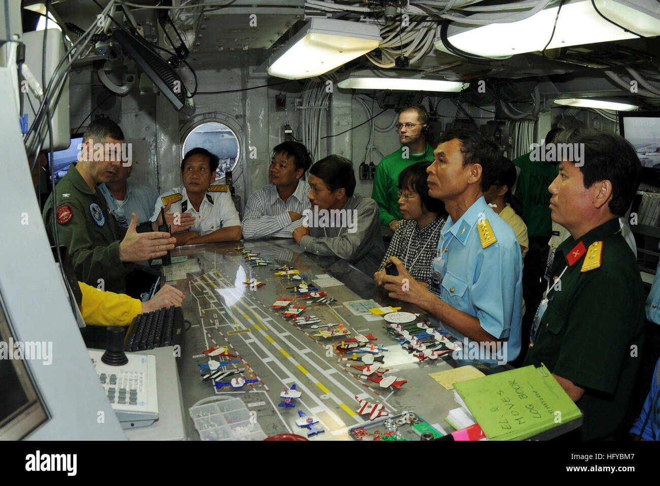 100808-N-4830B-033  PACIFIC OCEAN (Aug. 8, 2010) Capt. Daniel Grieco, left, executive officer of the aircraft carrier USS George Washington (CVN 73), explains flight deck operations to senior military and civilian officials from Vietnam. The visit is one of the events scheduled during a five-day engagement commemorating the 15th anniversary of the normalization of relations between Vietnam and the United States. George Washington, the NavyÕs only permanently forward-deployed aircraft carrier, is underway helping to ensure security and stability in the western Pacific Ocean. (U.S. Navy photo by Stock Photo