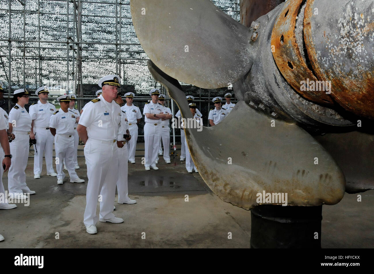 100826-N-7478G-235 PYEONGTAEK, Republic of Korea (Aug. 26, 2010) Capt. Rudy Lupton, commanding officer of the U.S. 7th Fleet command ship USS Blue Ridge, examines the bent propellor of Republic of Korea (ROK) corvette (ROKS) Cheonan (PCC 772). A non-contact homing torpedo exploded near the ship Mar. 26, 2010, sinking it, resulting in the death of 46 ROK navy sailors. Blue Ridge serves under Commander, Expeditionary Strike Group (ESG) 7/Task Force (CTF) 76, the Navy's only forward deployed amphibious force. (U.S. Navy photo by Mass Communication Specialist 2nd Class Cynthia Griggs/Released) US  Stock Photo