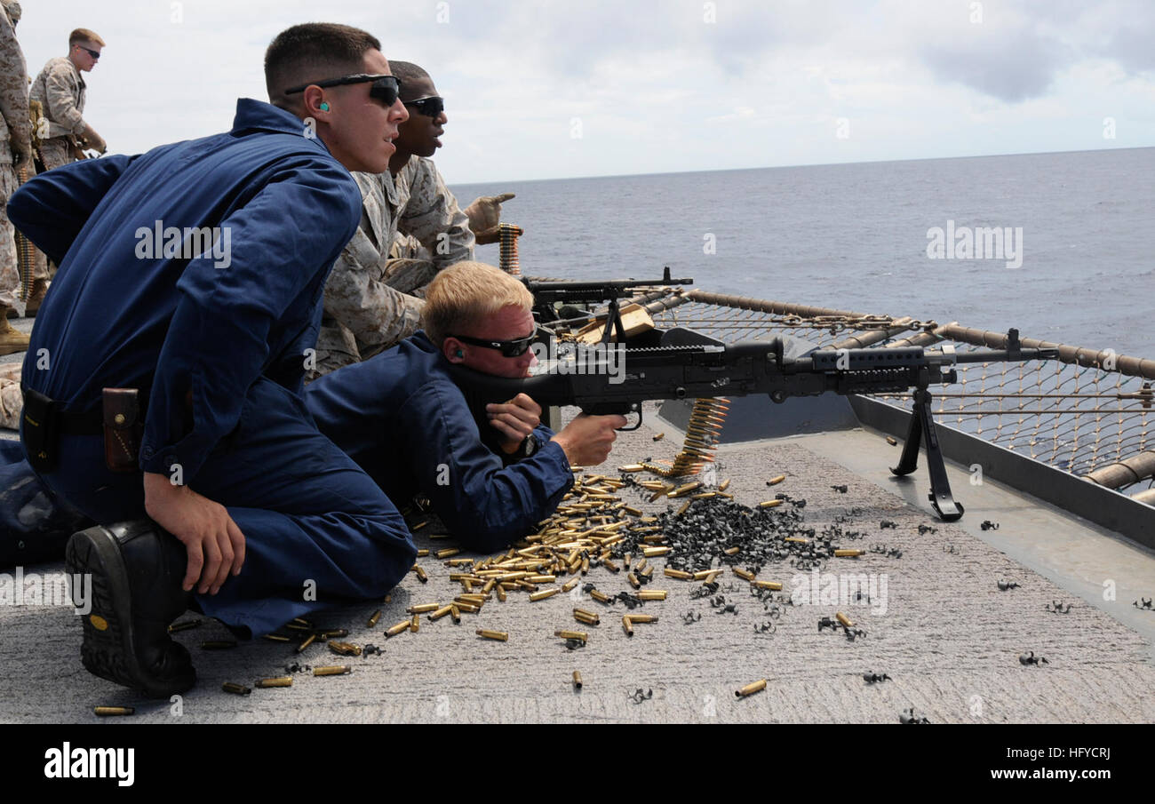 Gunner's Mate aboard USS Blue Ridge receives target instructions while ...