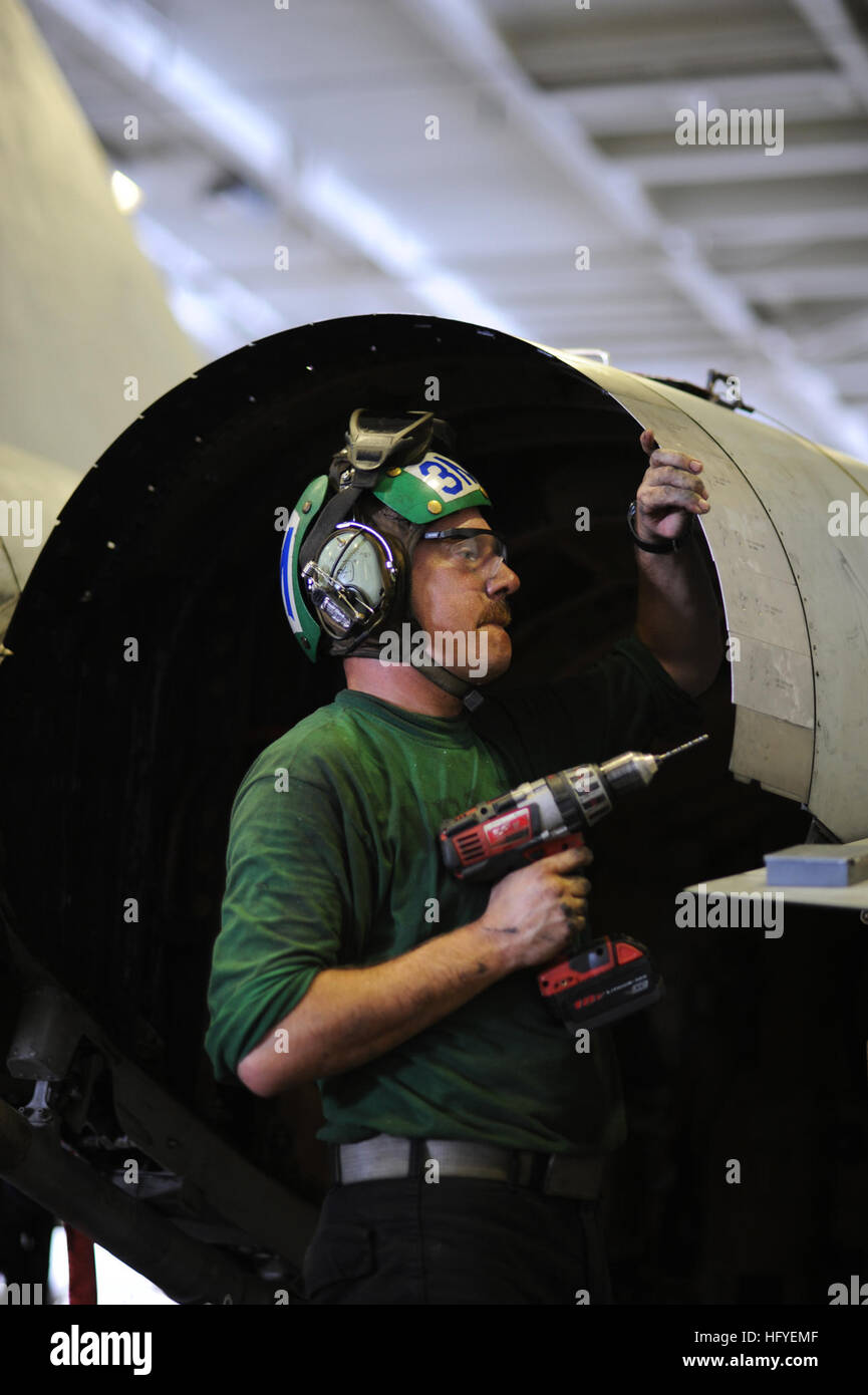 101008-N-3793B-039 ARABIAN SEA (Oct. 8, 2010) Aviation Structural Mechanic 3rd Class Joseph Morton, from Kansas City, Kan., assigned to the Ragin' Bulls of Strike Fighter Squadron (VFA) 37, conducts maintenance the variable diameter exhaust nozzle fairing on an F/A-18C Hornet. VFA-37 is deployed as part of the Harry S. Truman Carrier Strike Group in support of maritime security operations and theater security cooperation efforts in the U.S. 5th Fleet area of responsibility. (U.S. Navy photo by Mass Communication Specialist 3rd Class Marie Brindovas/Released) US Navy 101008-N-3793B-039 Aviation Stock Photo