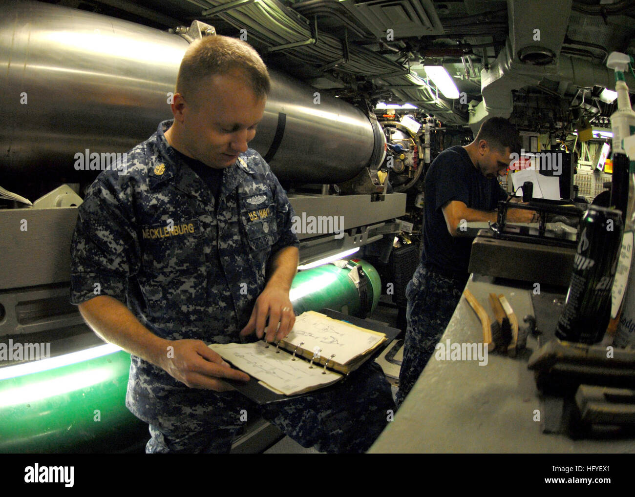 101013-N-7705S-010 NORFOLK (Oct. 13, 2010) Chief MachinistÕs Mate Tim Mecklenberg, from Killeen, Texas, verifies the maintenance procedures for torpedo room equipment aboard the Los Angeles-class attack submarine USS Norfolk (SSN 714). (U.S. Navy photo by Mass Communication Specialist 1st Class Todd A. Schaffer/Released) US Navy 101013-N-7705S-010 Chief Machinist's Mate Tim Mecklenberg, from Killeen, Texas, verifies the maintenance procedures for torpedo room equipm Stock Photo