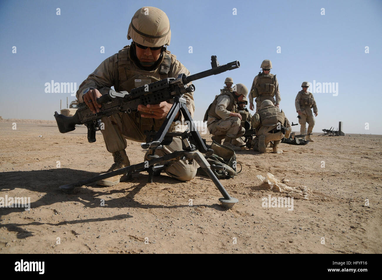 101016-N-0475R-098 HELMAND PROVINCE, Afghanistan (Oct. 16, 2010) Construction Electrician 2nd Class Daniel Garcia, left, sets up an M60 machine gun as other Seabees assigned to Naval Mobile Construction Battalion (NMCB) 5 set up their weapons during crew served weapons qualifications at Camp Leatherneck, Afghanistan. NMCB-5 is deployed to Afghanistan executing general engineering, infrastructure construction and project management in support of Operation Enduring Freedom. (U.S. Navy photo by Mass Communication Specialist 2nd Class Ace Rheaume/Released) US Navy 101016-N-0475R-098 Construction E Stock Photo