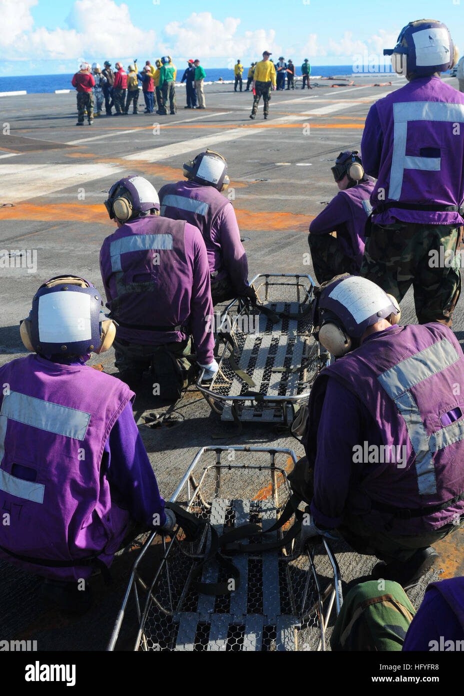 101030-N-6567V-130 PACIFIC OCEAN (Oct. 30,2010) Aviation Boatswain's Mates (Fuel) serve as stretcher bearers during a mass casualty drill aboard the aircraft carrier USS George Washington (CVN 73). George Washington, the Navy's only permanently forward-deployed aircraft carrier, is underway helping to ensure security and stability in the western Pacific Ocean. (U.S. Navy photo by Mass Communication Specialist Seaman Marcos Vazquez/Released) US Navy 101030-N-6567V-130 Aviation Boatswain's Mates (Fuel) serve as stretcher bearers during a mass casualty drill aboard the aircraft carrier US Stock Photo