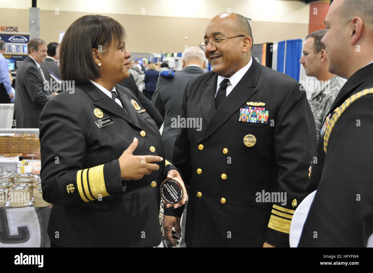 101101-N-1162S-003 PHOENIX (Nov. 1, 2010) U.S. Surgeon General Regina Benjamin, left, and Navy Surgeon General Vice Adm. Adam M. Robinson Jr. tour the convention floor during the 116th annual meeting of the Association of Military Surgeons of the United States in the Phoenix Convention Center. More than 3,000 federal, international and military medical professionals shared best practices and challenges in global healthcare. (U.S. Navy photo by Capt. Cappy Surette/Released) US Navy 101101-N-1162S-003 U.S. Surgeon General Regina Benjamin, left, and Navy Surgeon General Vice Adm. Adam M. Robinson Stock Photo