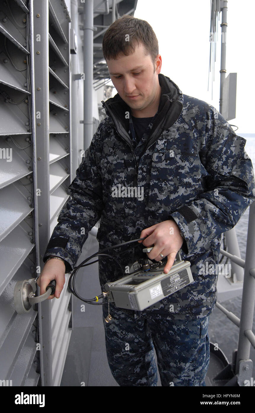 110323-N-SF508-008 PACIFIC OCEAN (March 23, 2011) Machinist's Mate 1st Class Mike Jetson, from Poulsbo, Wash., measures radiation levels on the air intakes of the Ticonderoga-class guided-missile cruiser USS Shiloh (CG 67) during a radiation survey and decontamination evolution. Shiloh is off the northeastern coast of Japan conducting humanitarian assistance operations as part of Operation Tomodachi. (U.S. Navy photo by Mass Communication Specialist 3rd Class Charles Oki/Released) US Navy 110323-N-SF508-008 Machinist's Mate 1st Class Mike Jetson, from Poulsbo, Wash., measures radiation levels  Stock Photo