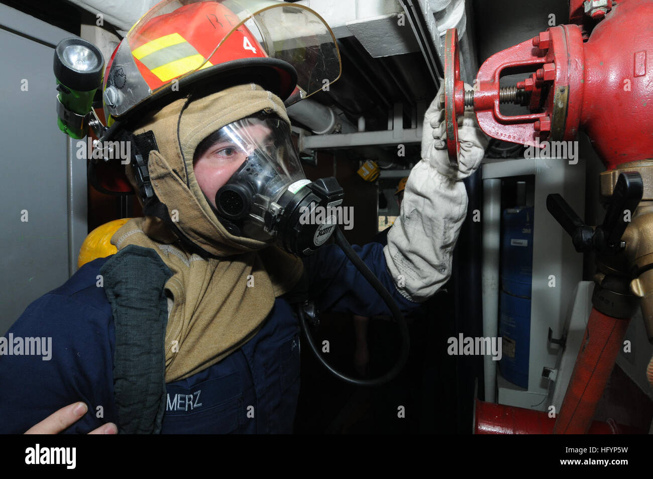 A Damage Controlman participates in an integrated training scenario ...