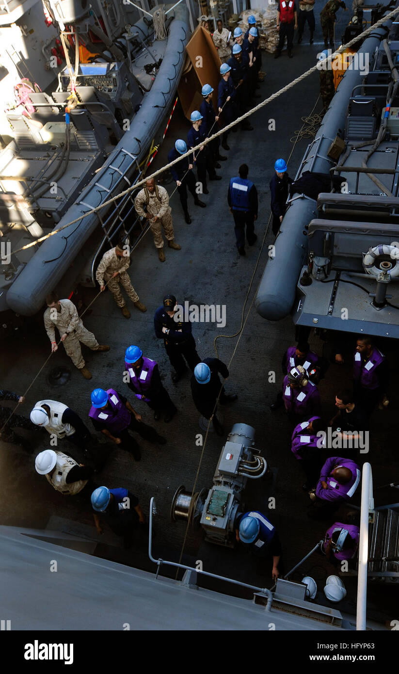 110413-N-OS574-059  ATLANTIC OCEAN (April 13, 2011) Sailors heave lines on the boat deck aboard the San Antonio-class amphibious transport dock ship USS Mesa Verde (LPD 19) during a replenishment at sea. Mesa Verde is deploying as part of the Bataan Amphibious Ready Group to the Mediterranean Sea. (U.S. Navy photo by Mass Communication Specialist 2nd Class Josue L. Escobosa/Released) US Navy 110413-N-OS574-059 Sailors heave lines on the boat deck aboard the San Antonio-class amphibious transport dock ship USS Mesa Verde (LPD 19) Stock Photo