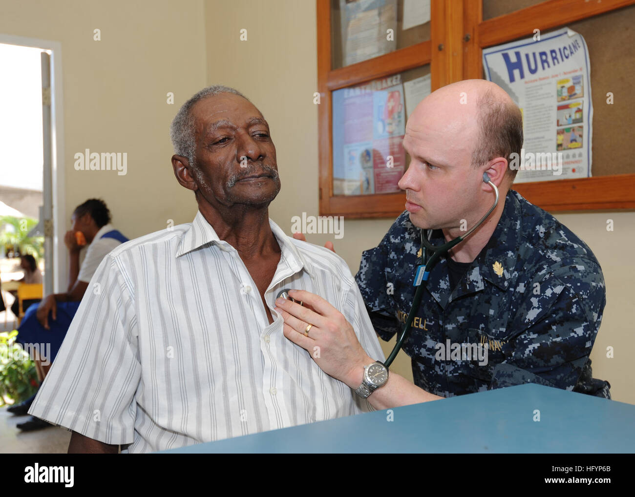 110413-N-NY820-065  KINGSTON, Jamaica (April 13, 2011) Lt. Cmdr. Karl Mitchell examines a Jamaican man on the first day of medical screening during Continuing Promise 2011 (CP11). CP11 is a five-month humanitarian assistance mission in the Caribbean, Central and South America. (U.S. Navy photo by Mass Communication Specialist 2nd Class Eric C. Tretter/Released) US Navy 110413-N-NY820-065 Lt. Cmdr. Karl Mitchell examines a Jamaican man on the first day of medical screening during Continuing Promise 2011 (CP Stock Photo