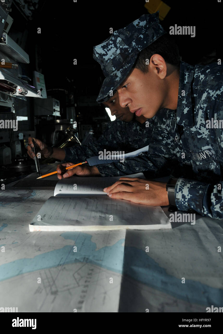 110509-N-NL541-126 ATLANTIC OCEAN (May 9, 2011) Quartermaster Seamen Quinntavius Wallace and Ephrain Rivera, both assigned to the guided-missile frigate USS Thach (FFG 43), perform nautical chart corrections while Thach is anchored off the coast of Rio Grande, Brazil. Thach is participating in the Atlantic phase of UNITAS 52 with the U.S. Coast Guard, and navies from Brazil, Mexico, and Argentina. (U.S. Navy photo by Mass Communication Specialist 3rd Class Stuart Phillips/Released) US Navy 110509-N-NL541-126 Sailors perform nautical chart corrections aboard Thach Stock Photo