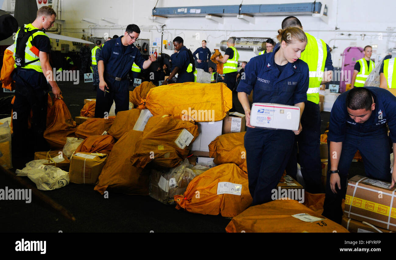 110513-N-OK922-521 PACIFIC OCEAN (May 13, 2011) Sailors sort mail in the hangar bay of the aircraft carrier USS Carl Vinson (CVN 70) during a replenishment at sea. Carl Vinson and Carrier Air Wing (CVW) 17 are underway in the U.S. 7th Fleet area of responsibility. (U.S. Navy photo by Mass Communication Specialist Seaman Rosa A. Arzola/Released) US Navy 110513-N-OK922-521 Sailors sort mail in the hangar bay of the aircraft carrier USS Carl Vinson (CVN 70) during a replenishment at sea Stock Photo