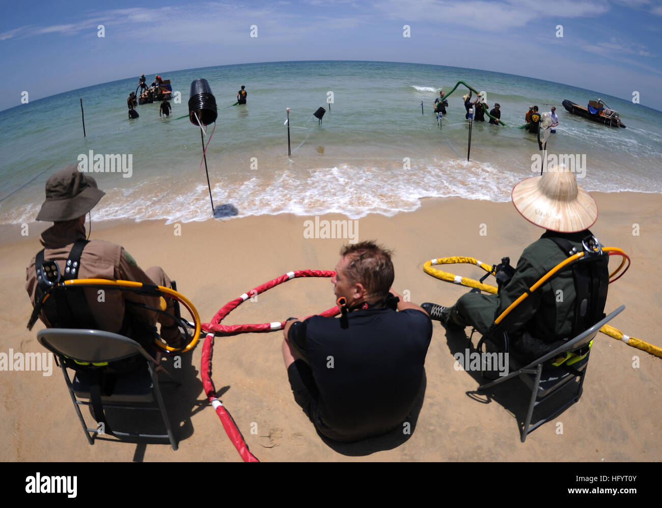 U.S. Navy divers from MDSU-1 conduct an underwater recovery mission ...