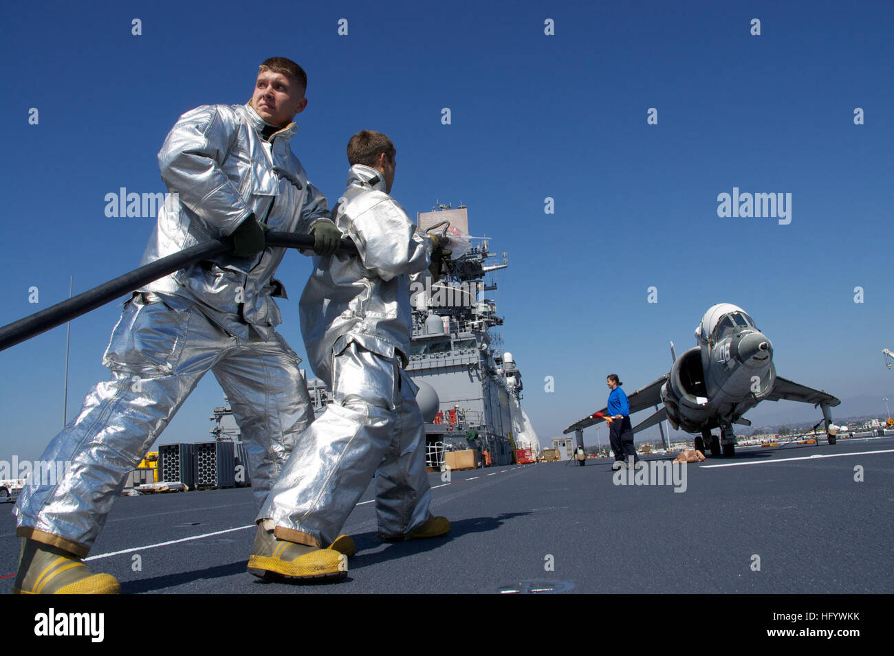 Sailors from the crash and salvage team aboard amphibious assault ship ...