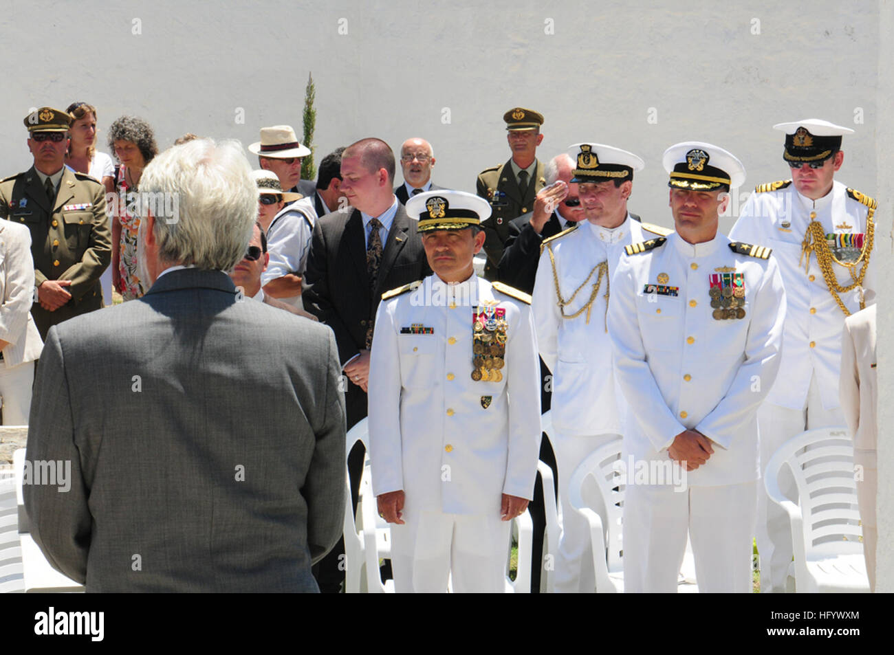 Vice Adm. Harry B. Harris, commander U.S. 6th Fleet, front-center, and Cmdr. Sean Anderson, commanding officer guided-missile destroyer USS Bulkeley (DDG 84), front-right, listen with other guests as British Ambassador Giles Paxman speaks during a memorial ceremony at the Anglo-Americano Cemetery in Menorca, Spain. Bulkeley is deployed as part of Enterprise Carrier Strike Group (CSG) in support of maritime security operations and theater security cooperation efforts in the U.S. 6th Fleet AOR. (U.S. Navy photo by Mass Communication Specialist 3rd Class Lauren G. Randall) USS Bulkeley operations Stock Photo