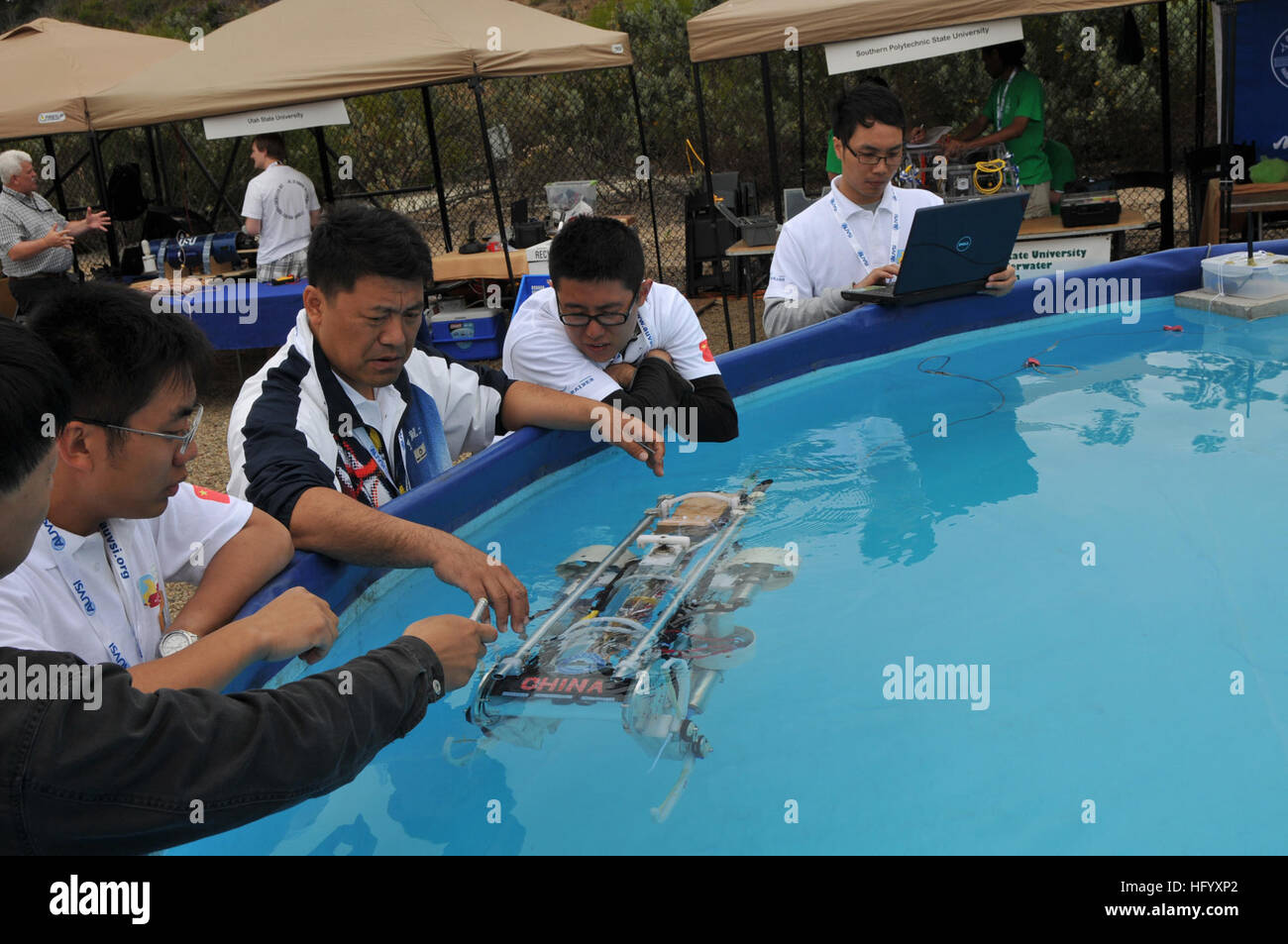 110713-N-UN340-037 SAN DIEGO (July 13, 2011) Students from ChinaÕs Harbin Engineering University perform in-water checks on their autonomous underwater vehicle (AUV) during the 14th annual International RoboSub Competition at Space and Naval Warfare Systems Center Pacific. The contest, co-sponsored by the U.S. Office of Naval Research and the Association for Unmanned Vehicle Systems International (AUVSI), challenges teams of student engineers to design AUVs to perform realistic missions in a simulated ocean environment. (U.S. Navy photo by Rick Naystatt/Released) US Navy 110713-N-UN340-037 Stu Stock Photo