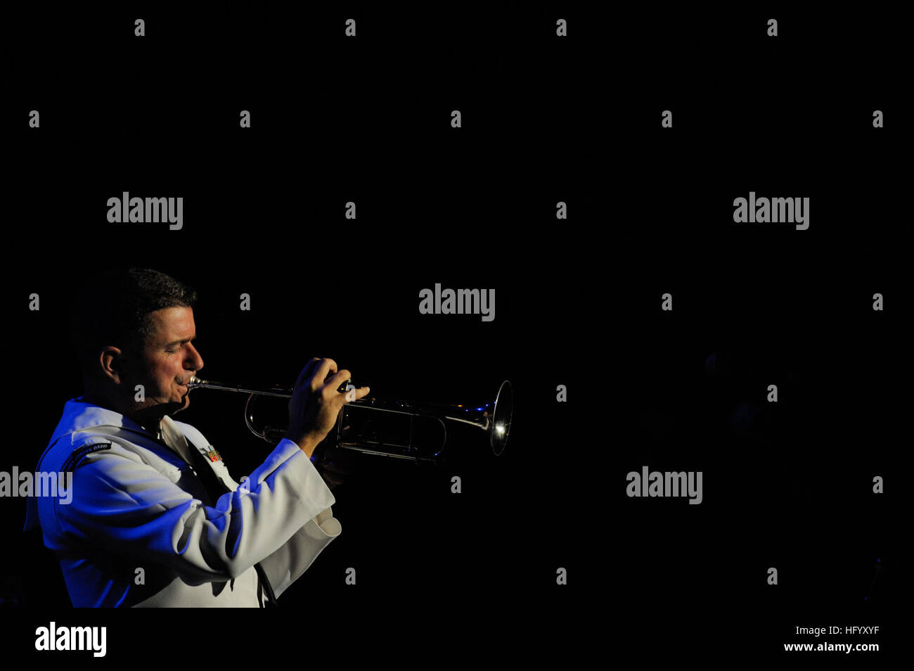 110715-N-RM525-551 SAN SALVADOR, El Salvador (July 15, 2011) Musician 1st Class Nathan Goebel, from Bayport, N.Y., plays the trumpet during a free concert by the U.S. Fleet Forces Band at the Industrias La Constancia Auditorium during Continuing Promise 2011. Continuing Promise is a five-month humanitarian assistance mission to the Caribbean, Central and South America. (U.S. Navy photo by Mass Communication Specialist 2nd Class Jonathen E. Davis/Released) US Navy 110715-N-RM525-551 Musician 1st Class Nathan Goebel, from Bayport, N.Y., plays the trumpet during a free concert by the U.S. Fleet F Stock Photo