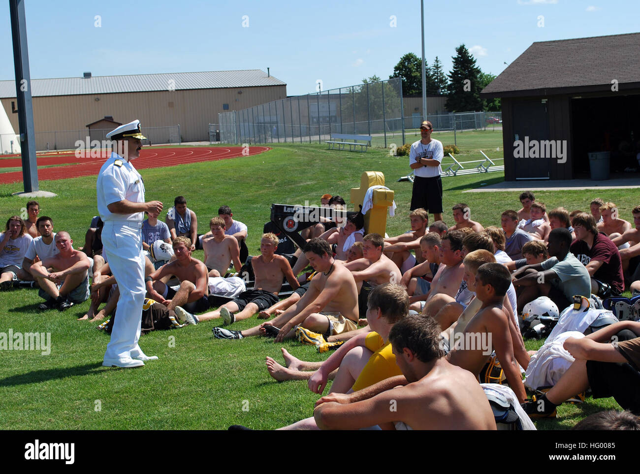 110811-N-CI293-167  FARGO, N.D. (Aug. 11, 2011) Rear Adm. Mark D. Guadagnini, deputy commander for Fleet Management and chief of staff for U.S. Fleet Forces Command, speaks to the Fargo South High School football team at a practice during Fargo Navy Week, one of 21 Navy weeks across America in 2011. Navy weeks are intended to showcase the investment Americans have made in their Navy and increase awareness in cities that do not have a significant Navy presence. (U.S. Navy photo by Senior Chief Mass Communication Specialist Susan Hammond/Released) US Navy 110811-N-CI293-167 Rear Adm. Mark D. Gua Stock Photo