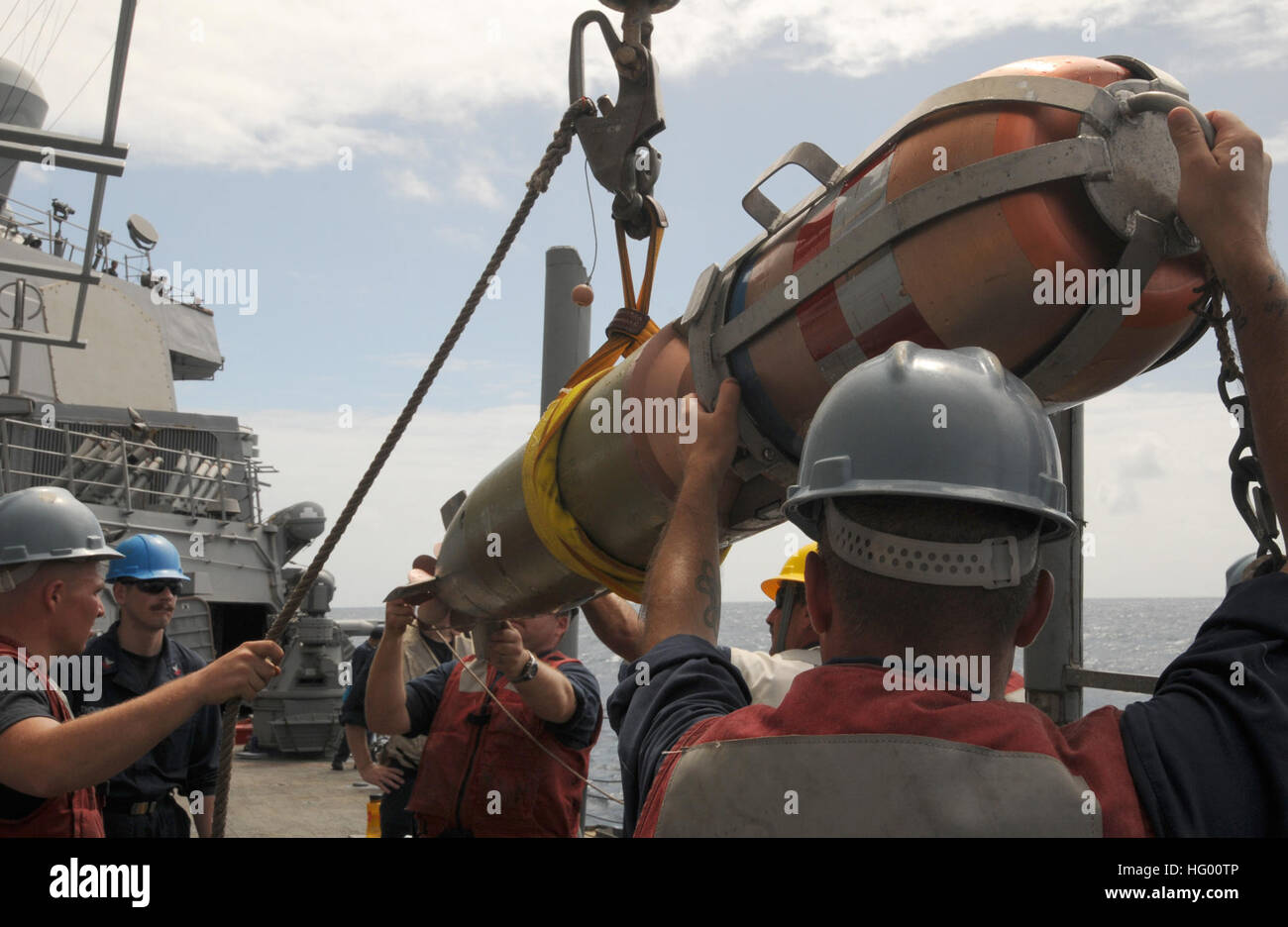 Sailors aboard the guided-missile destroyer USS Mitscher recover a MK ...