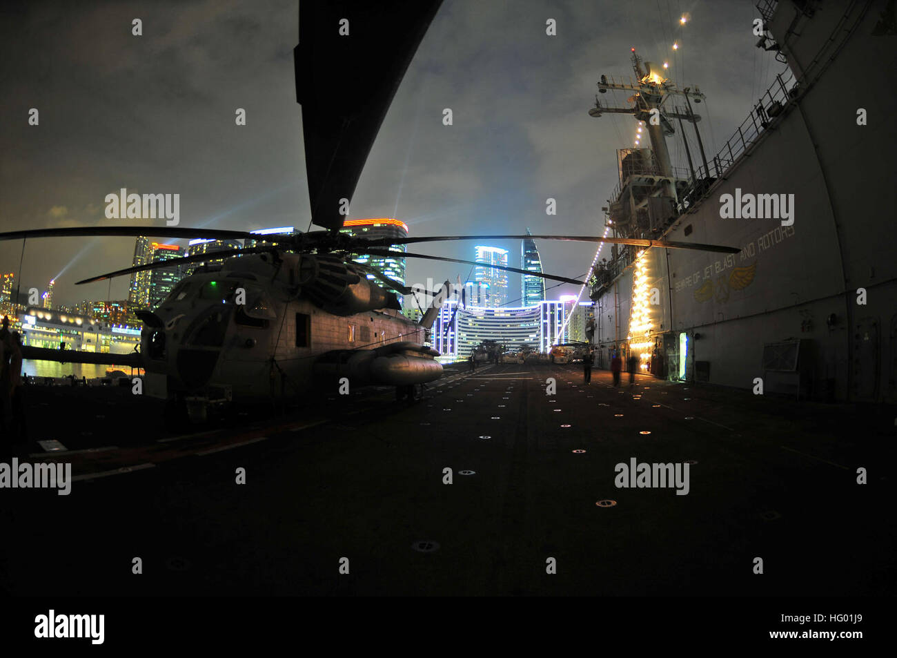 A CH-53 Sea Stallion helicopter assigned to the Evil Eyes of Marine Medium Helicopter Squadron 163 is displayed for viewing during a formal reception aboard the amphibious assault ship USS Boxer as part of a port visit to Hong Kong. Boxer and the embarked 13th Marine Expeditionary Unit are underway in the U.S. 7th Fleet area of responsibility during a western Pacific deployment. USS Boxer in Hong Kong DVIDS452141 Stock Photo