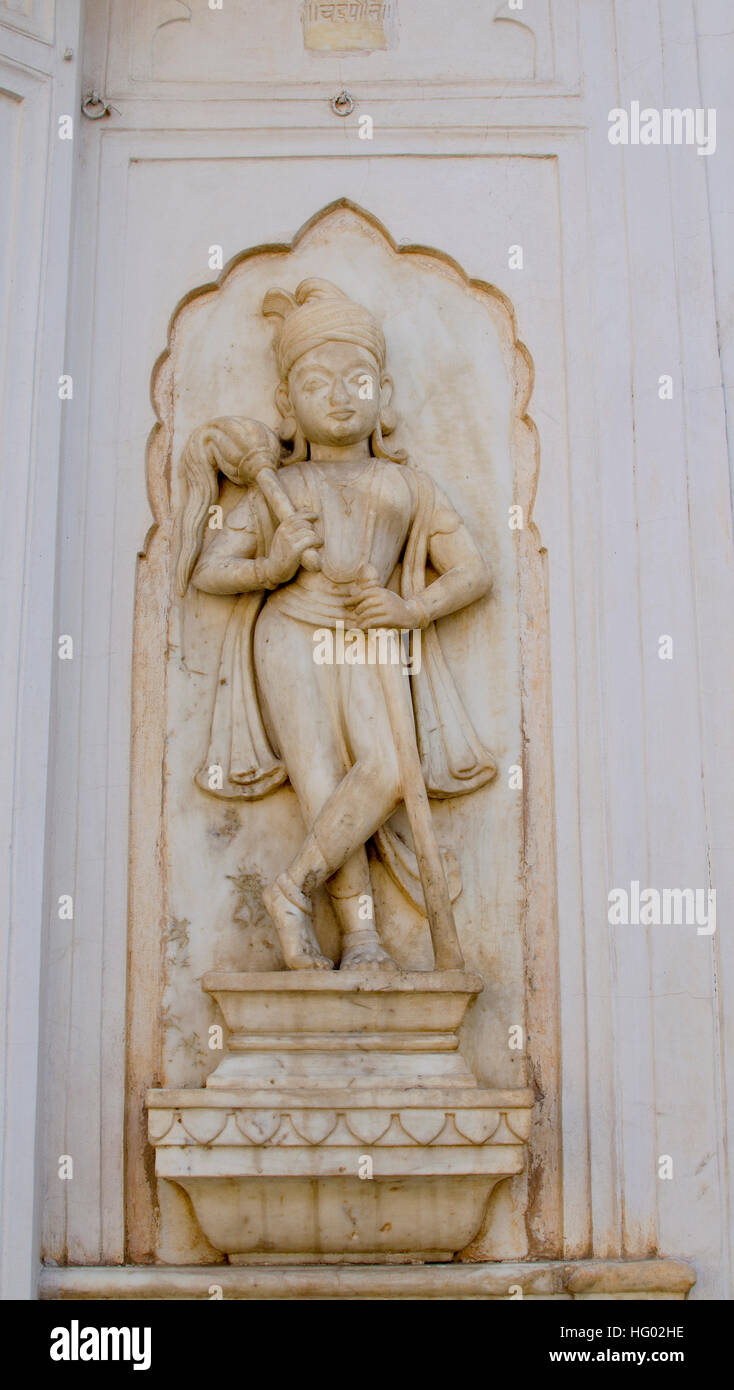 decorative adornment on a wall from a stone,scenery,ornament,a molding,a figure,the person,a zhnshchina,a decor,a carving,a ston Stock Photo